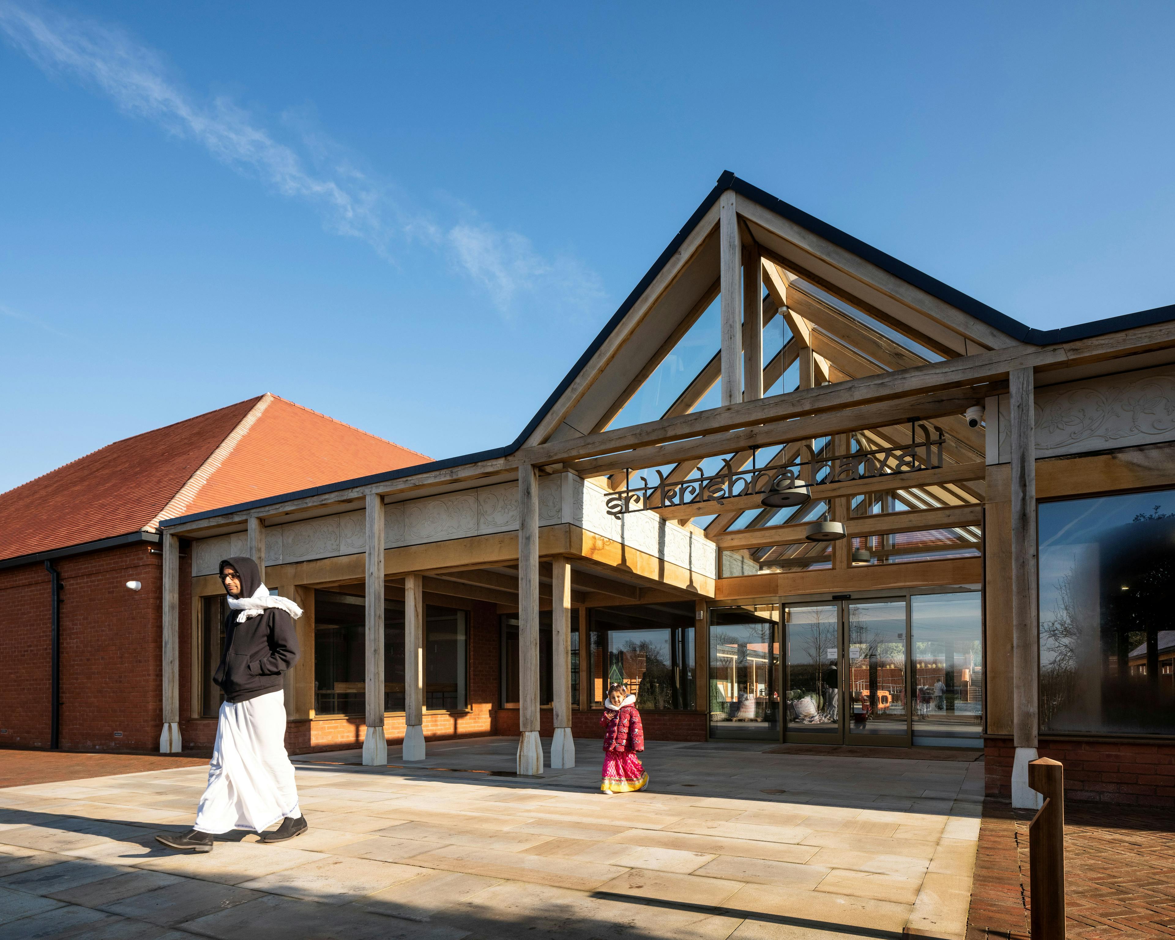 A green oak framed entranceway of a Hindu Temple