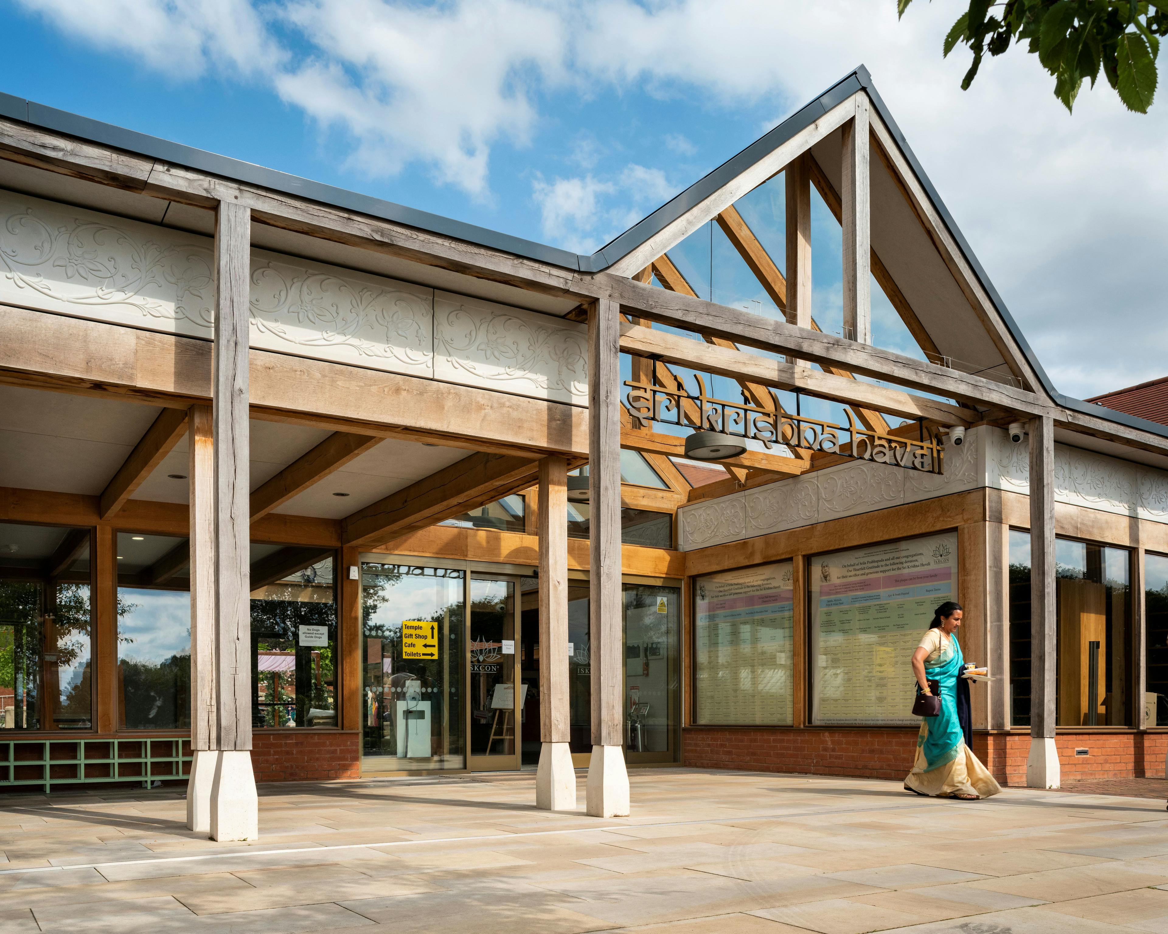 A green oak framed entranceway of a Hindu Temple