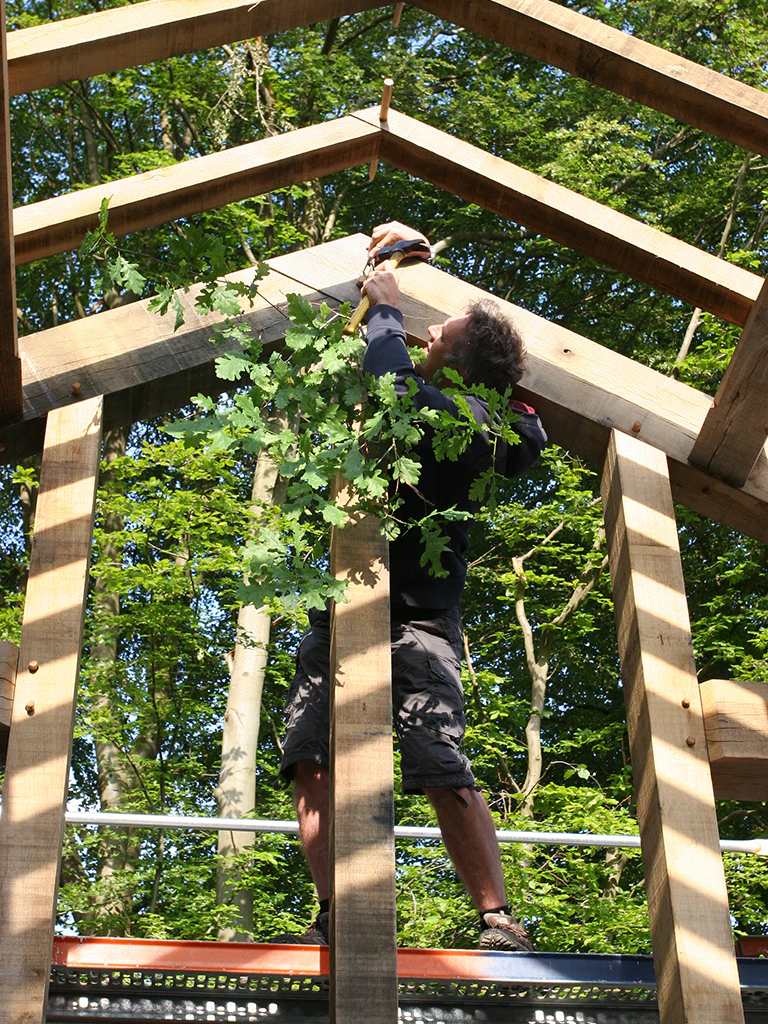 Large oak-framed house in Germany during the topping-out stage