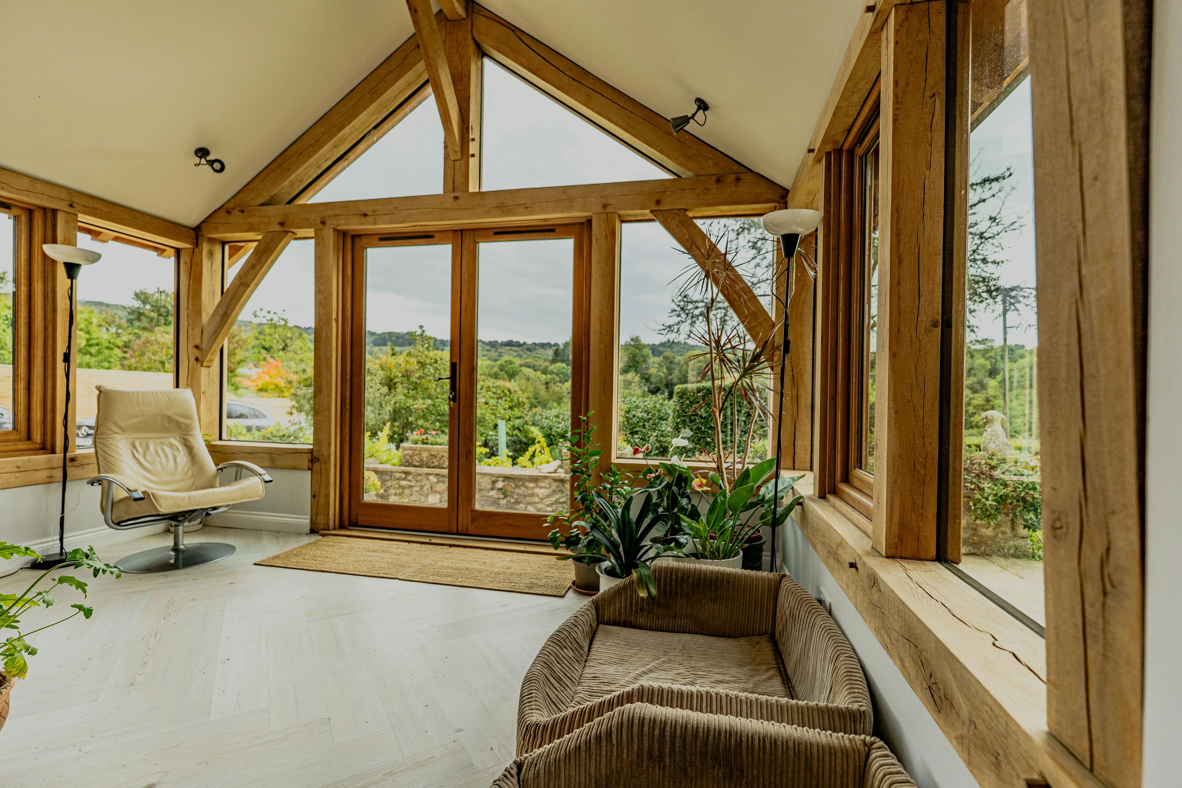 Interior of an oak frame garden room with direct glazing