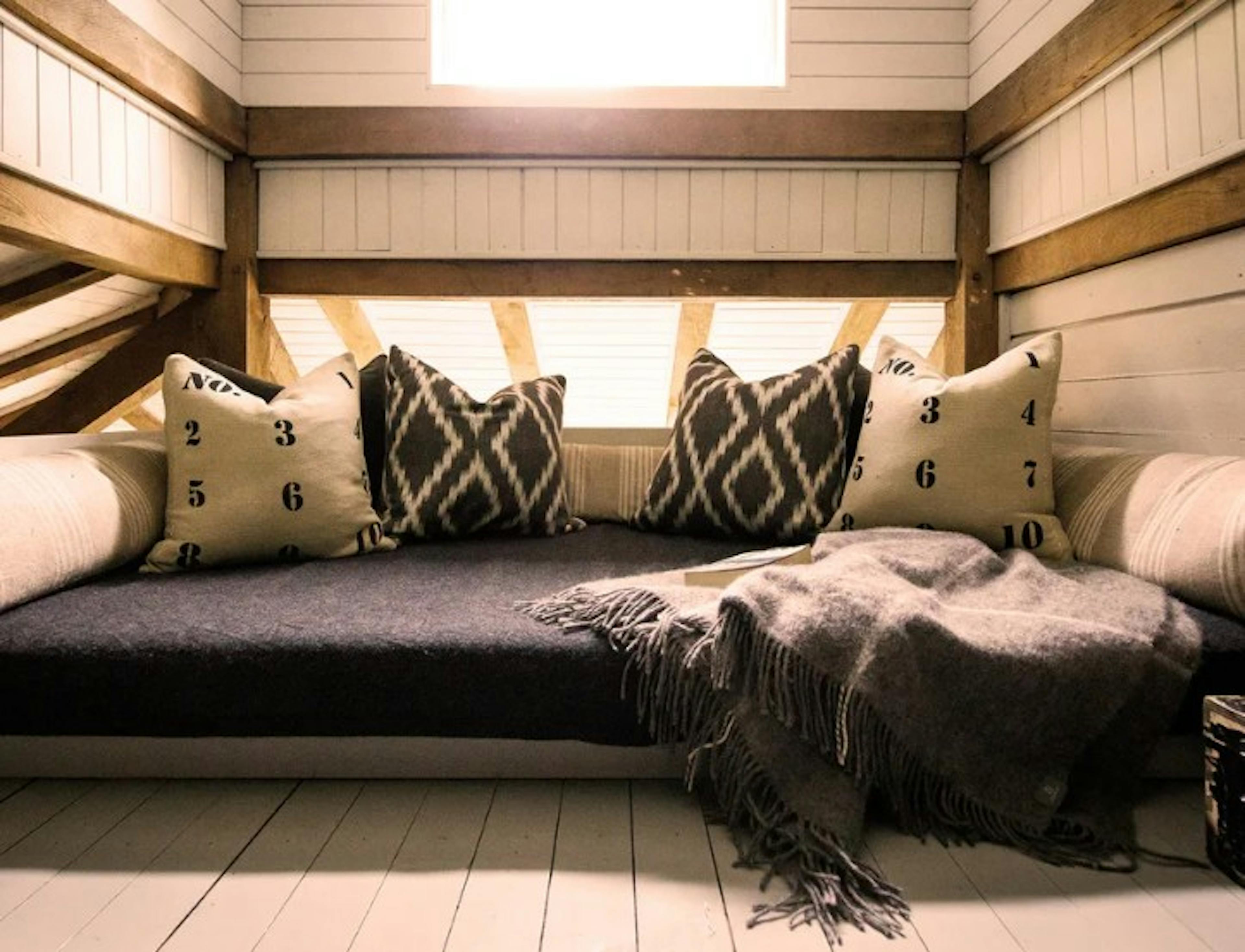 A mezzanine snug in an oak framed cabin