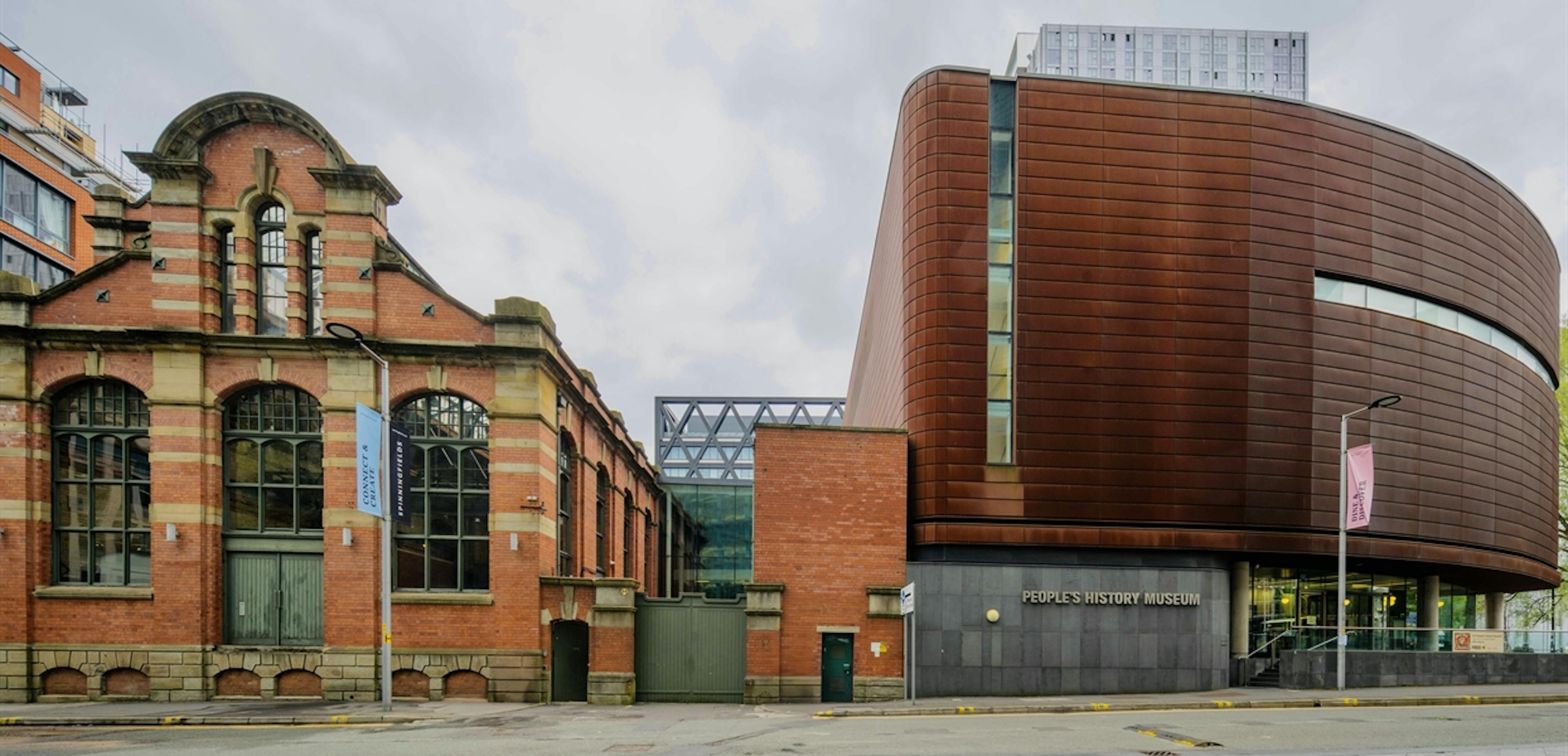 Exterior view of the People’s History Museum building, showing its modern glass and steel architecture beside the river.