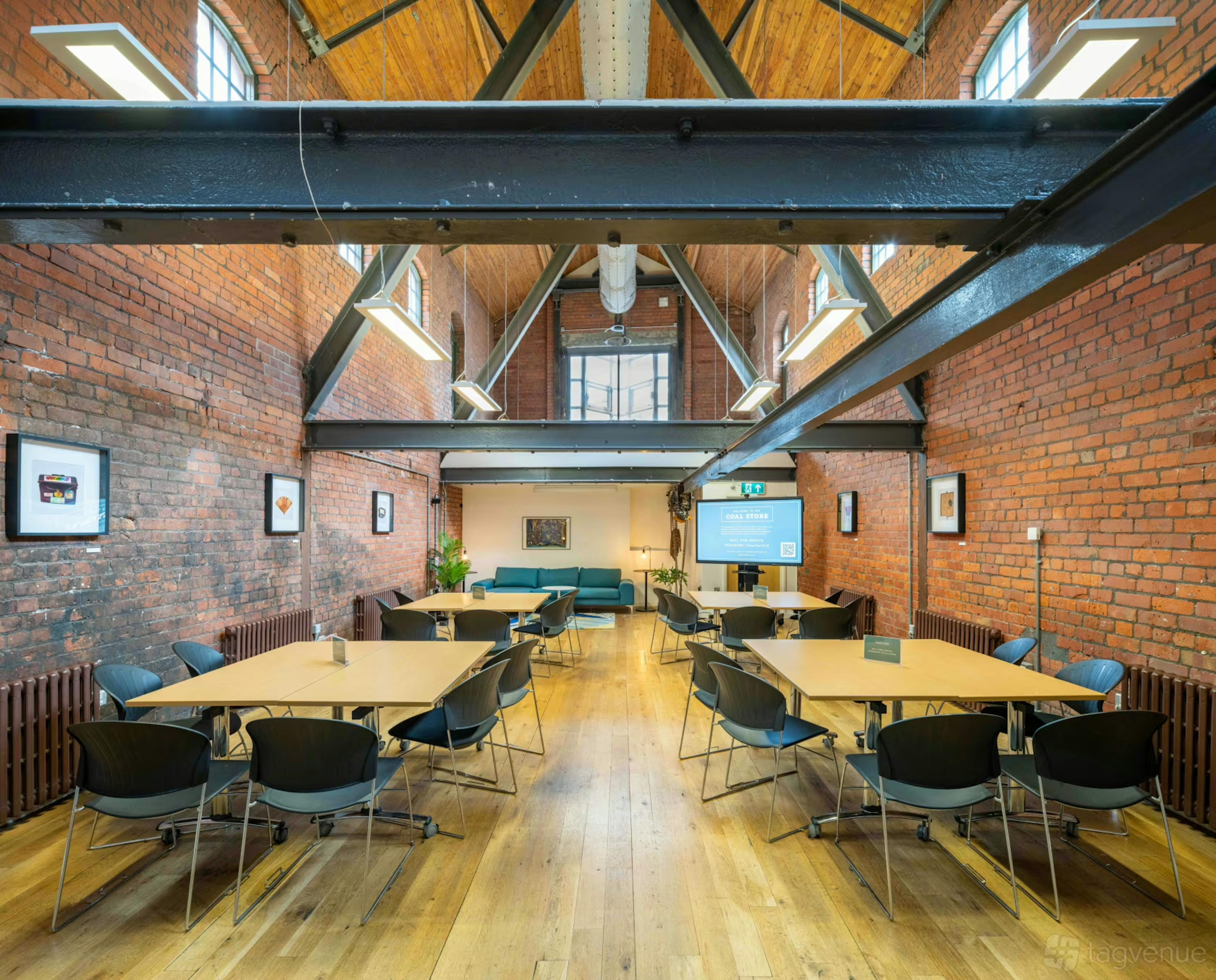 Interior view of the People’s History Museum, featuring open gallery spaces with industrial architecture and exhibition displays.