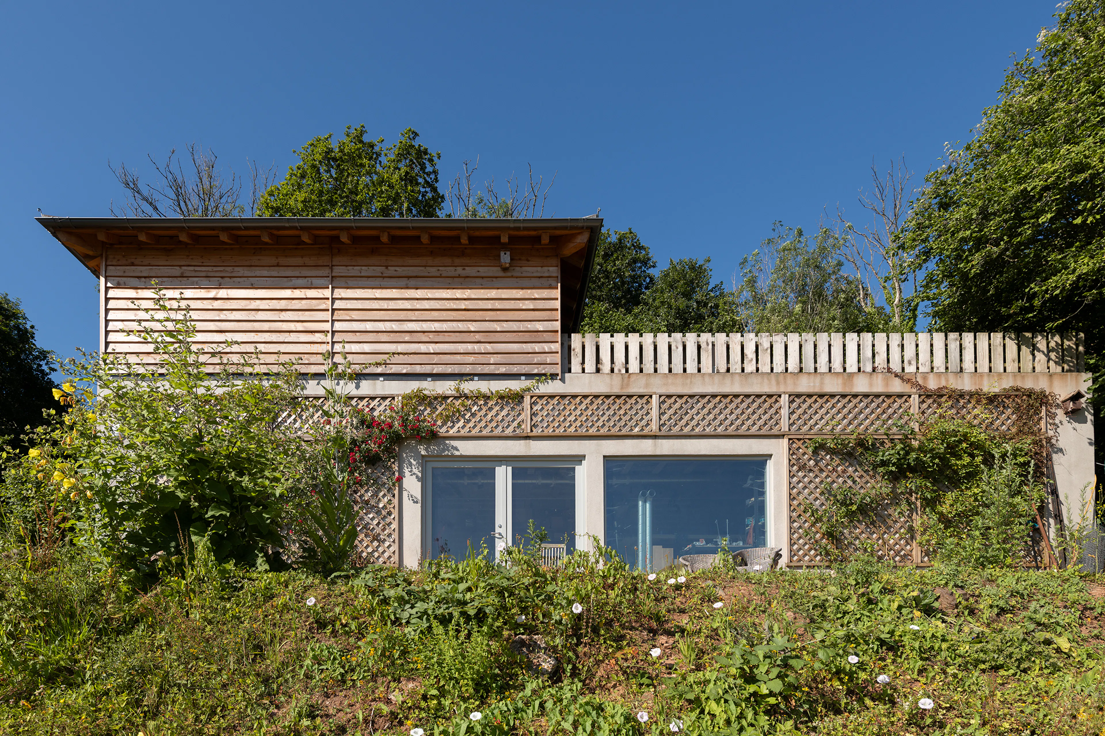 Exterior view of an oak framed garage with timber cladding