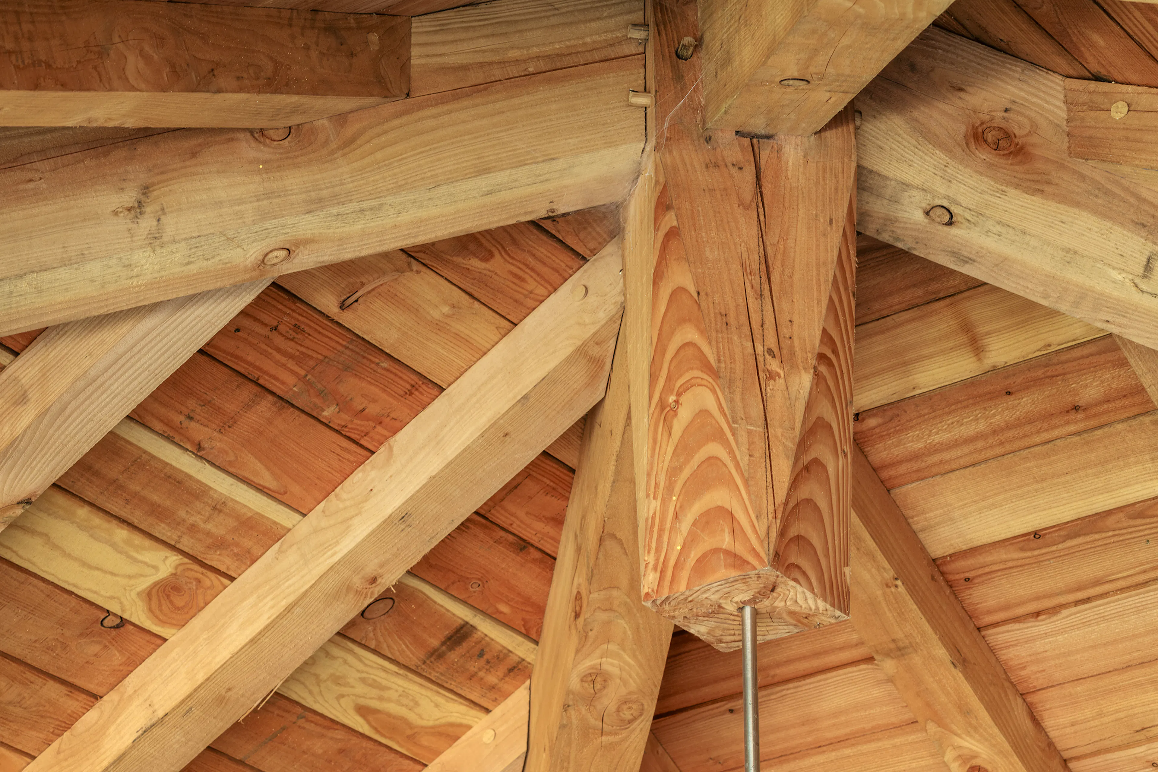 A detail of an oak framed garage with timber cladding