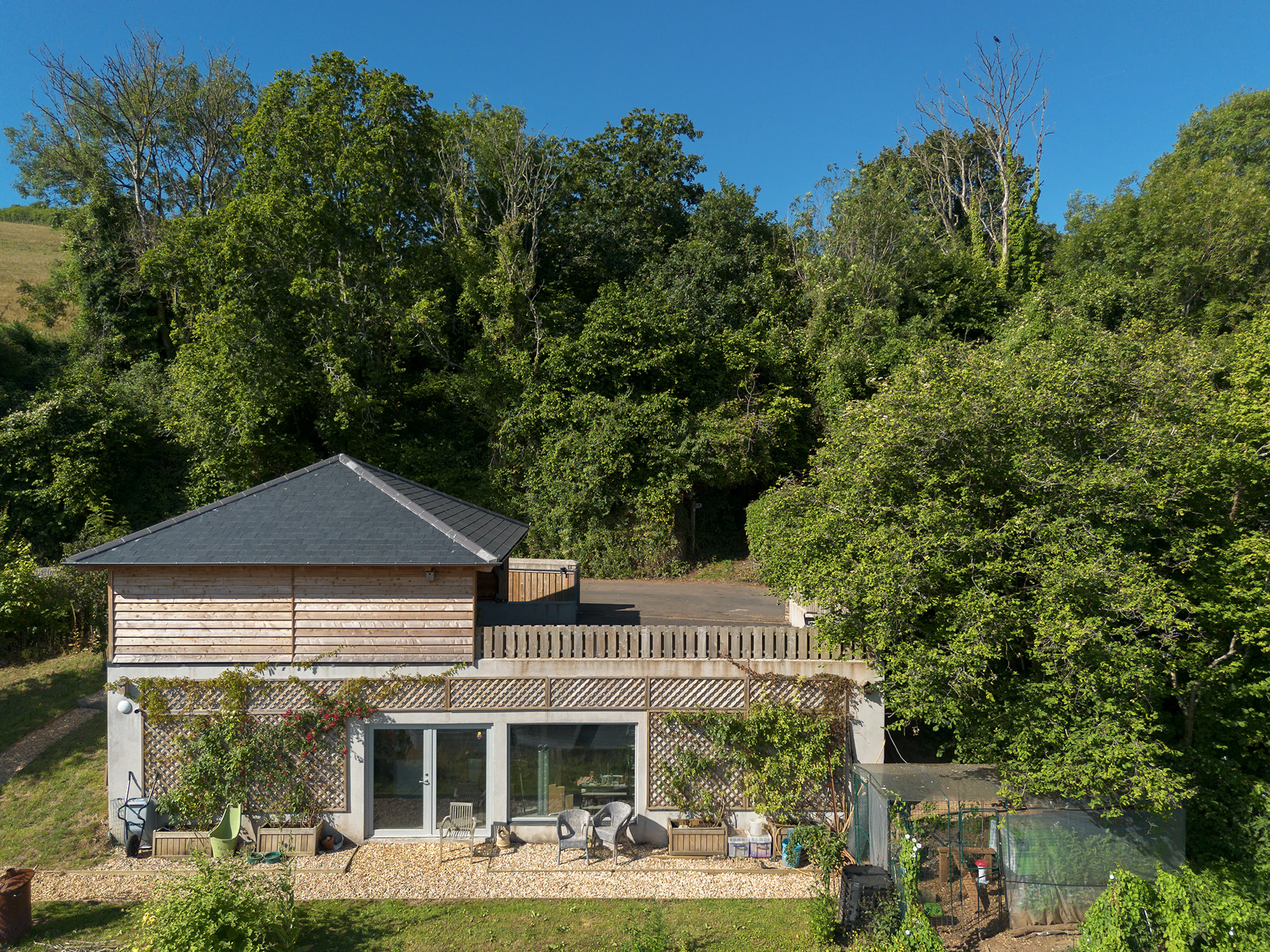 Exterior view of an oak framed garage with timber cladding