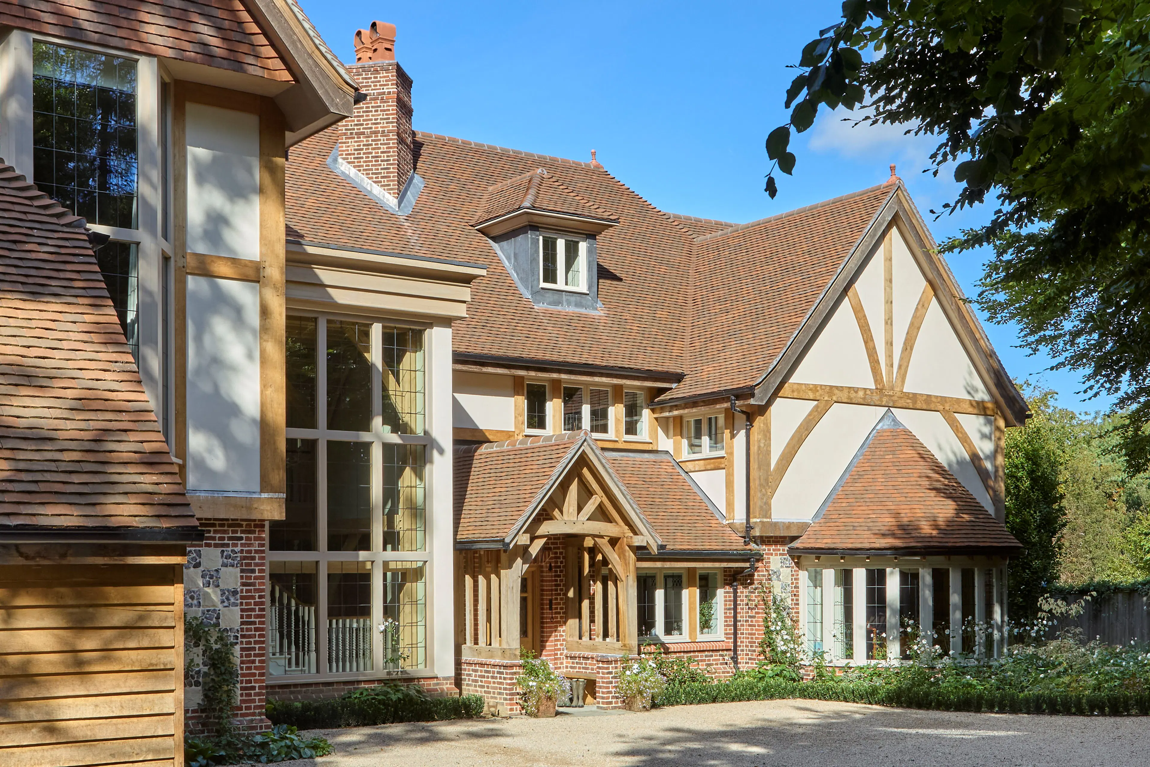 The front of a large 6 bedroom oak framed home
