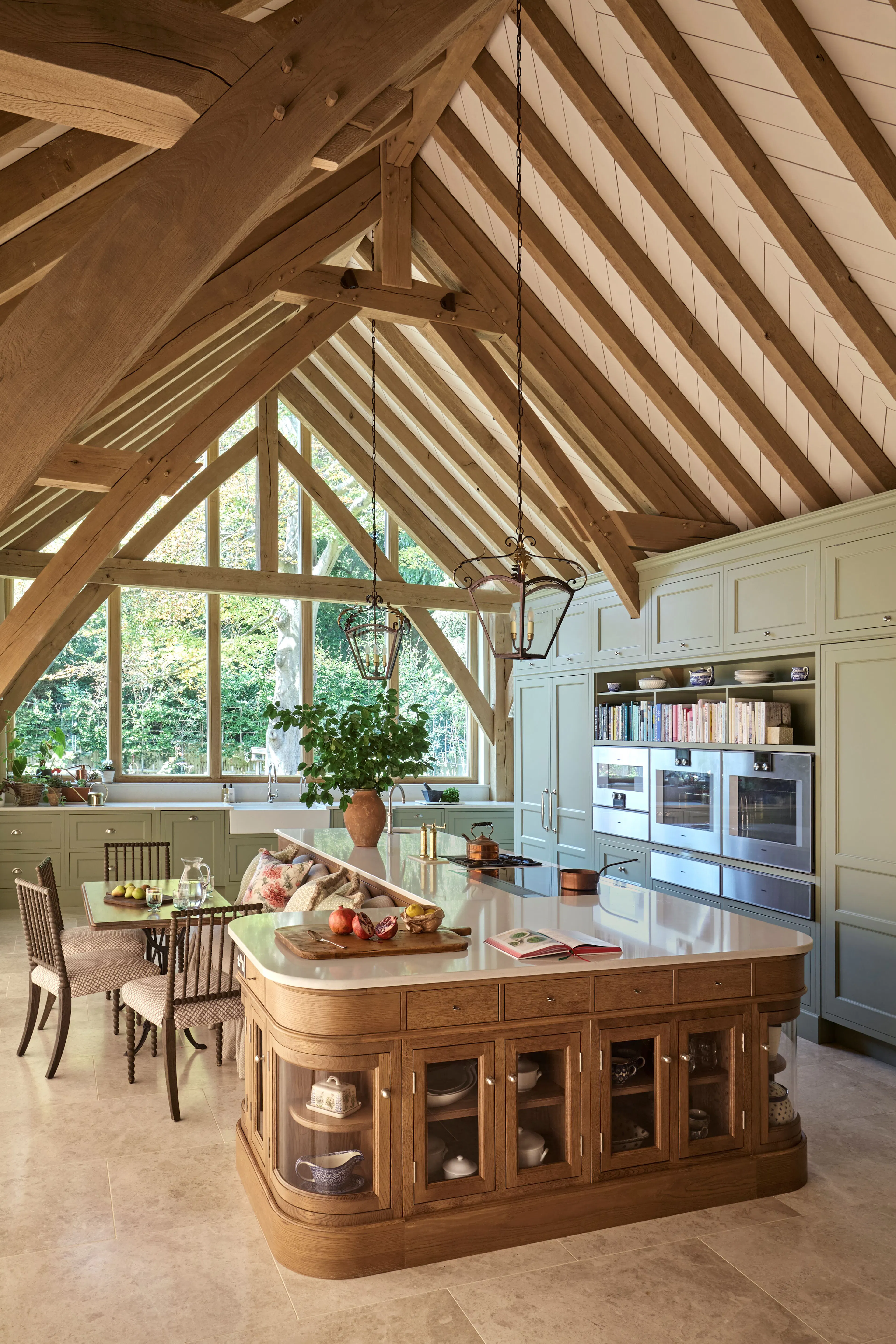 A kitchen with large island and vaulted ceiling in a large 6 bedroom oak framed home