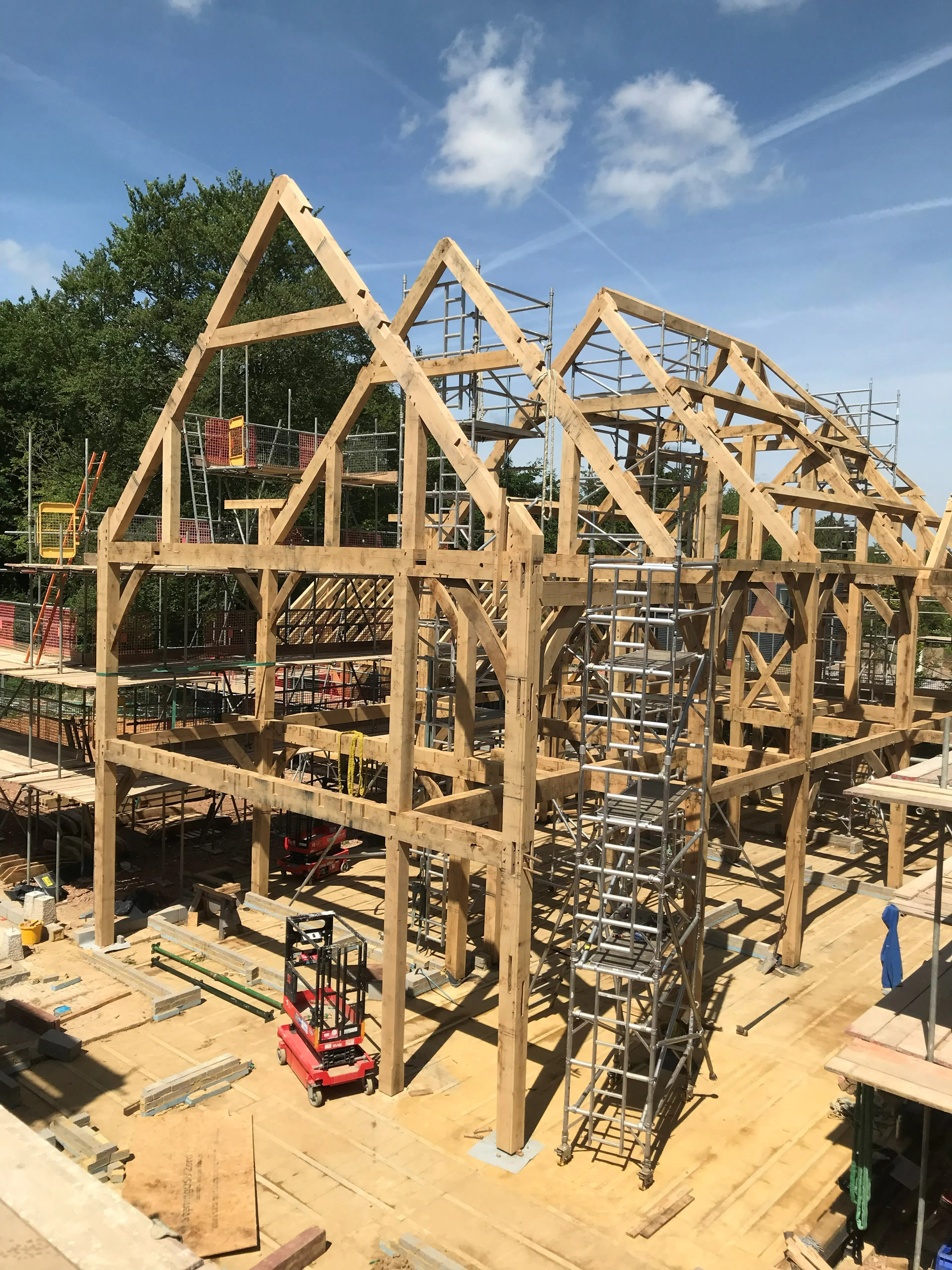 An oak frame on during installation of a large 6 bedroom oak framed family home
