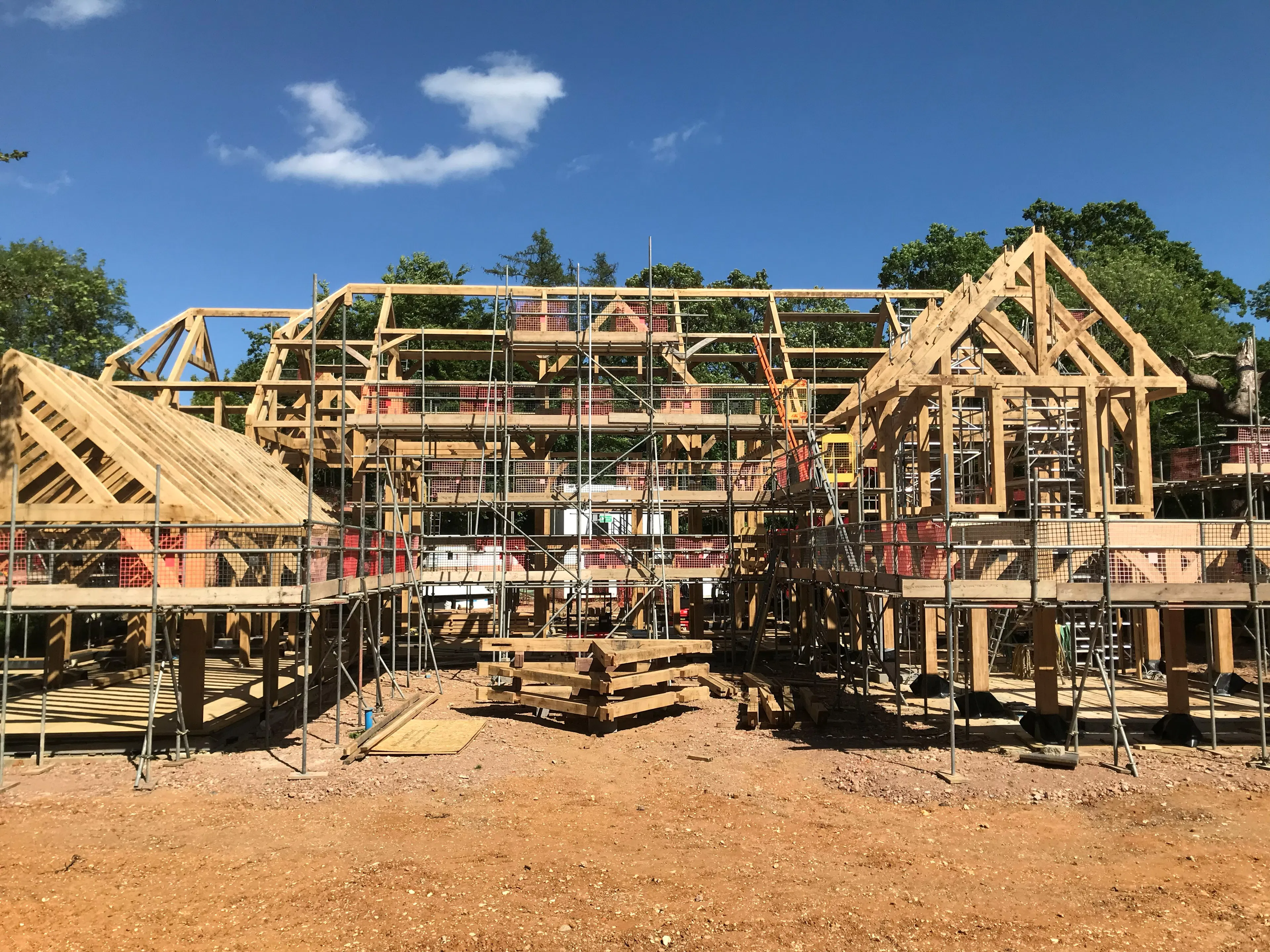 An oak frame on during installation of a large 6 bedroom oak framed family home