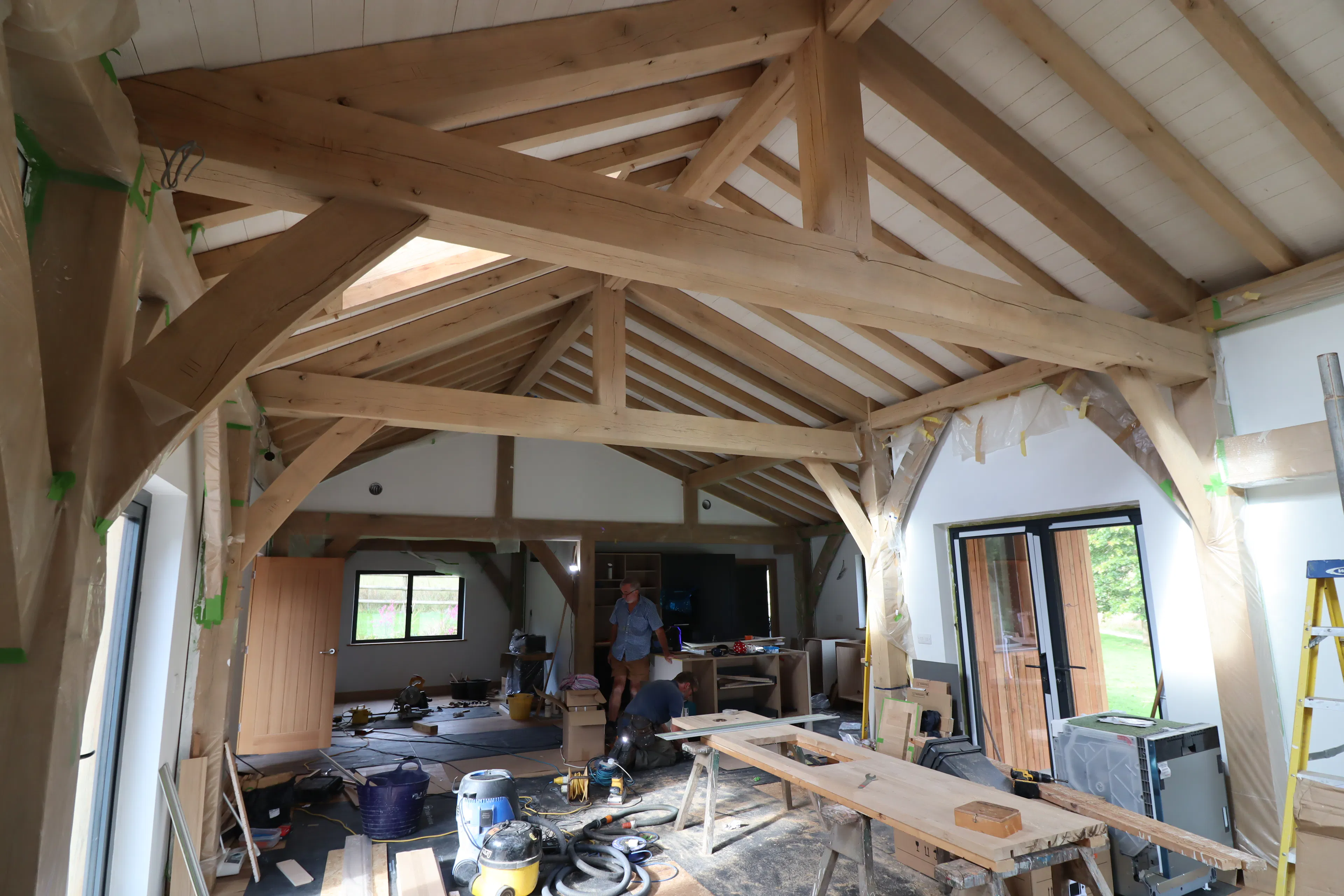 Interior view of an oak timber frame building under construction