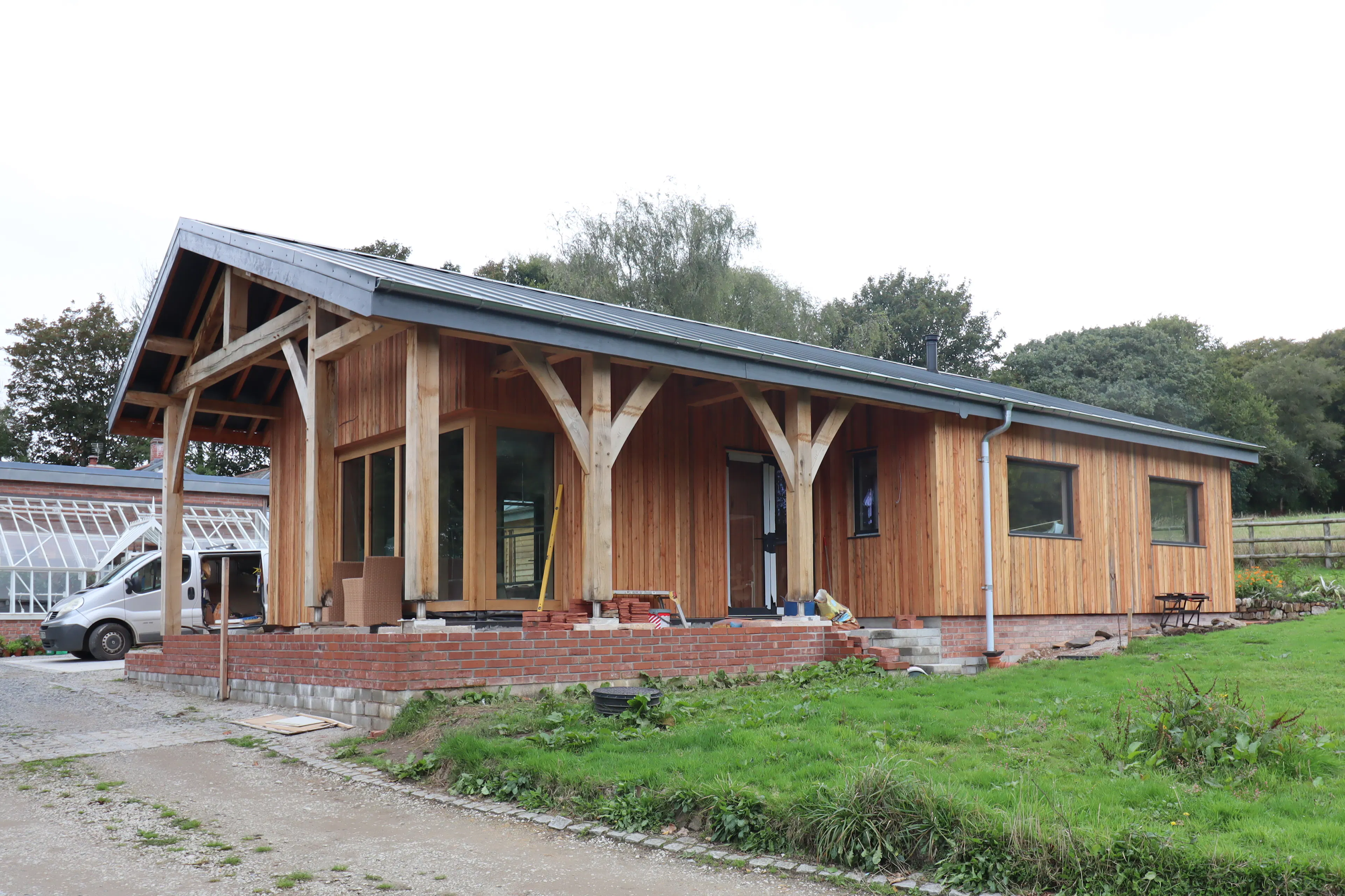 Finished oak-framed building with exterior cladding installed