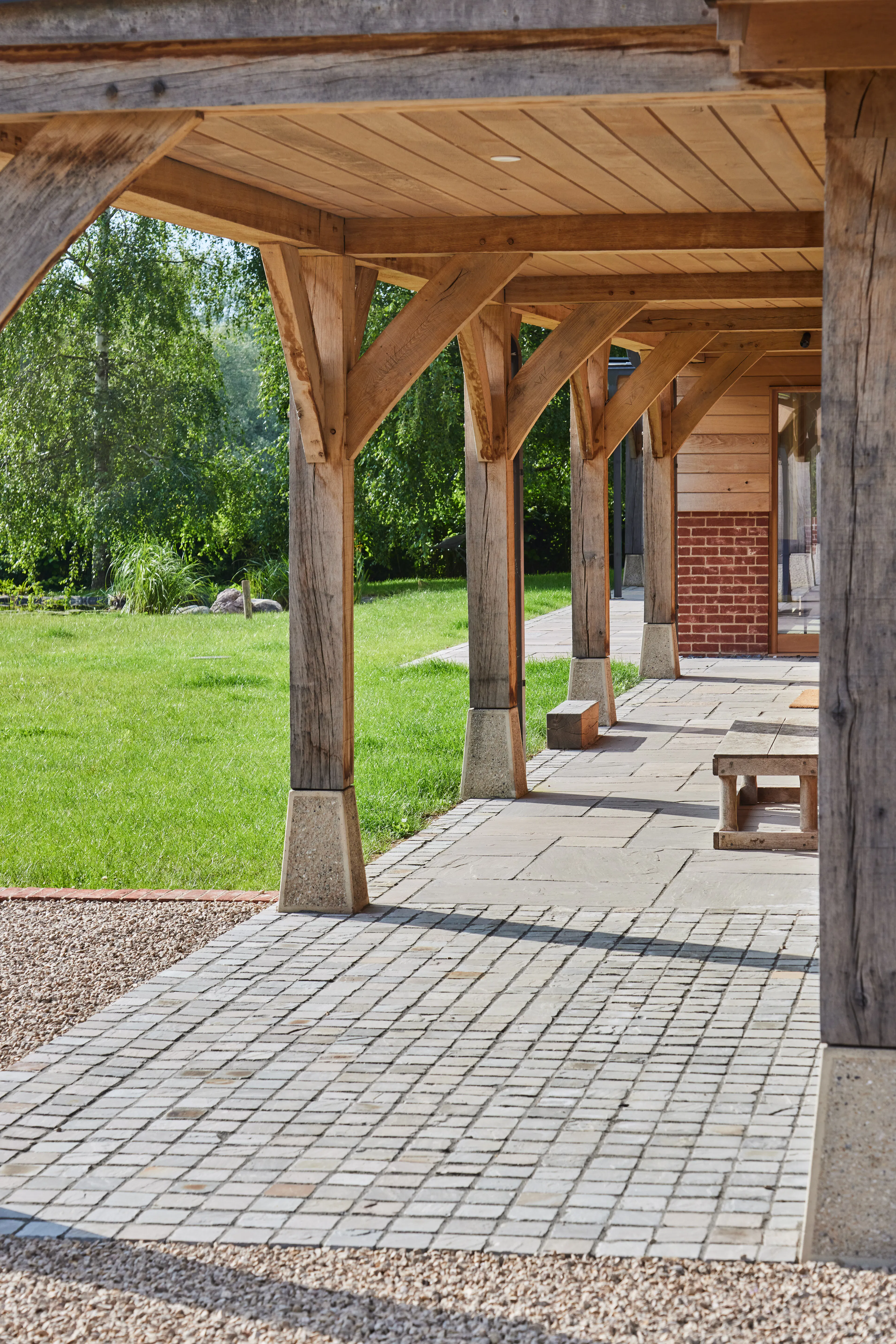 An oak frame veranda outside a large oak frame home