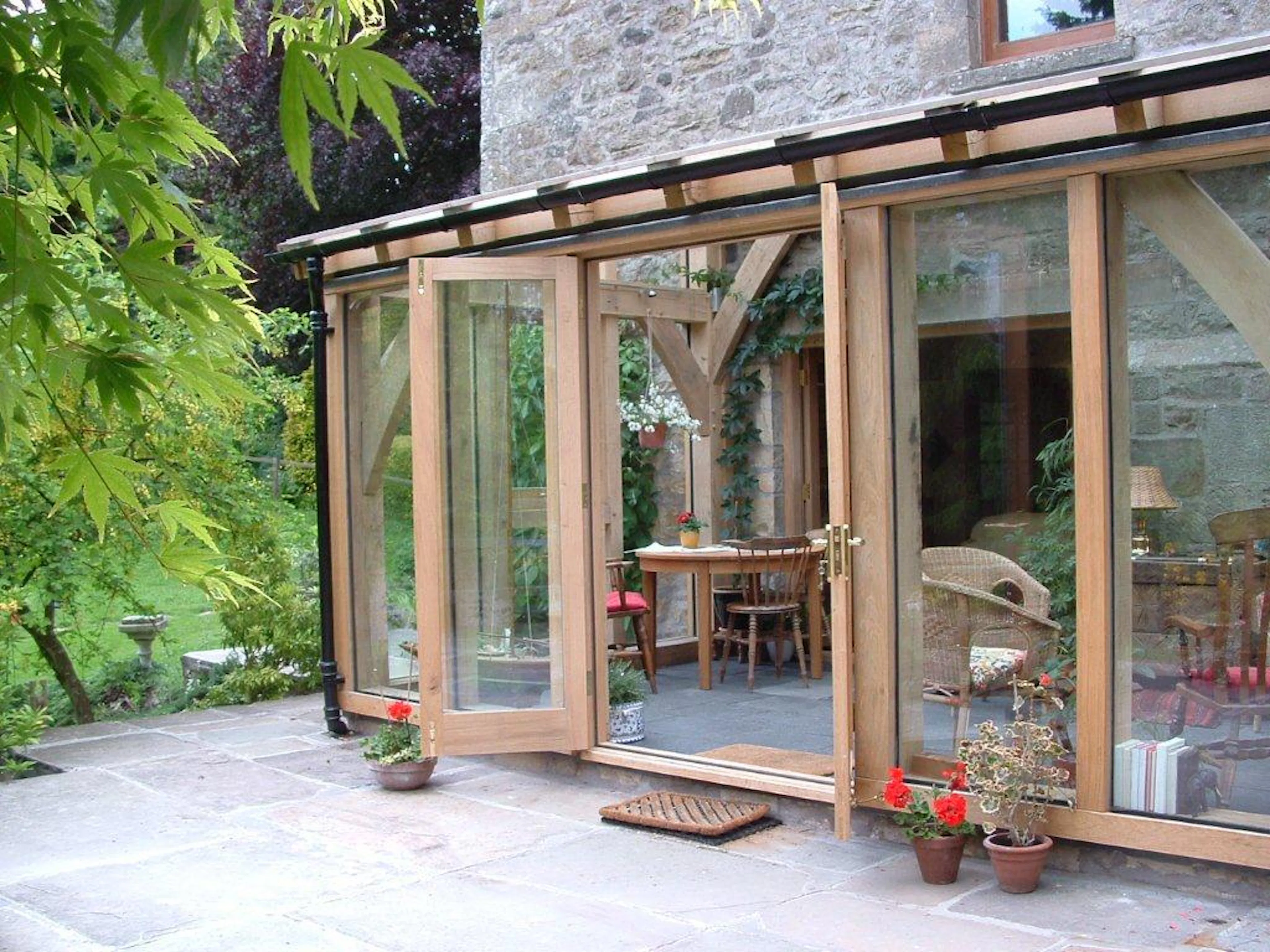 Exterior image of a glazed oak frame sun room or garden room
