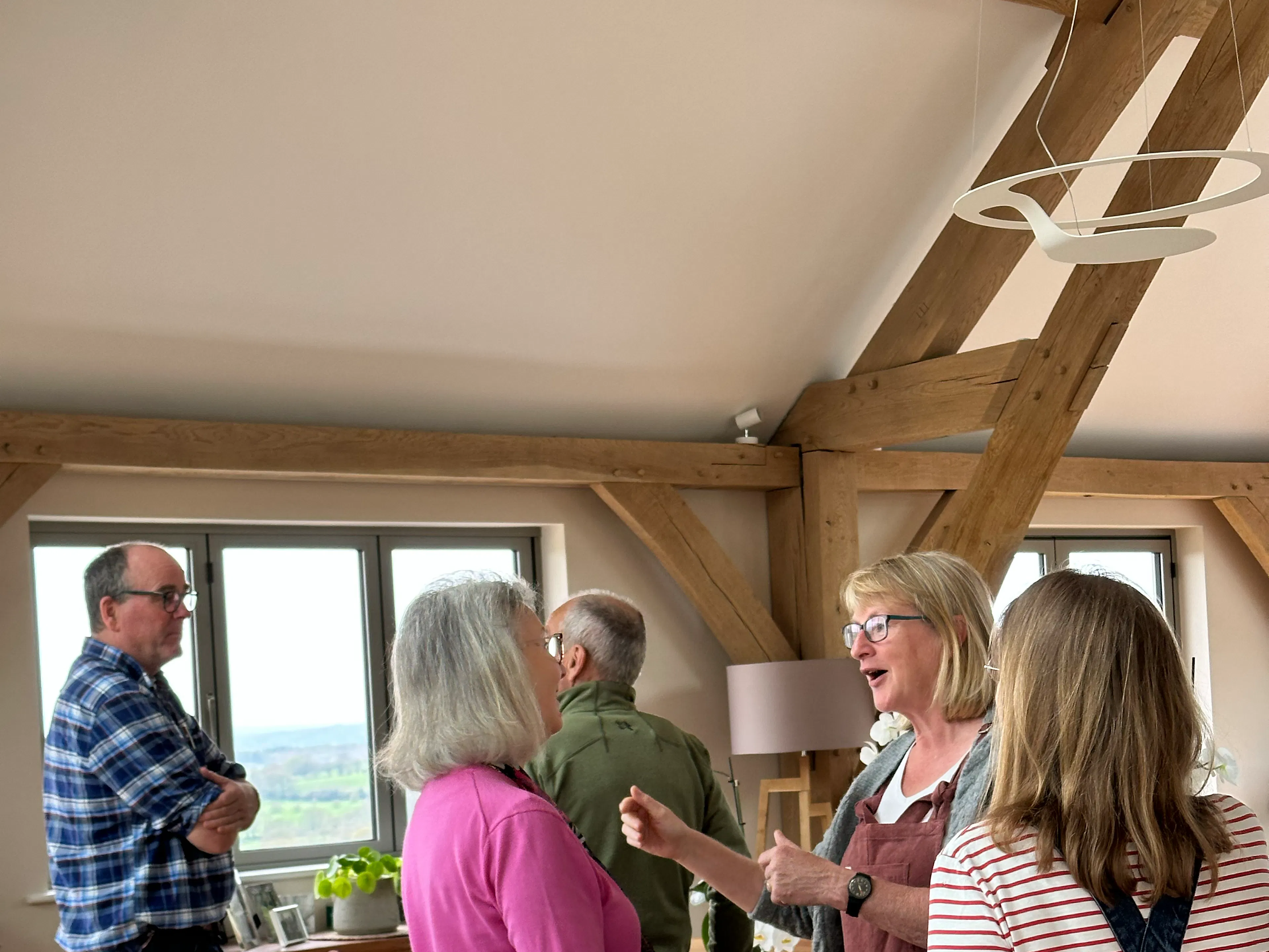 Attendees at an open house event at an oak framed home