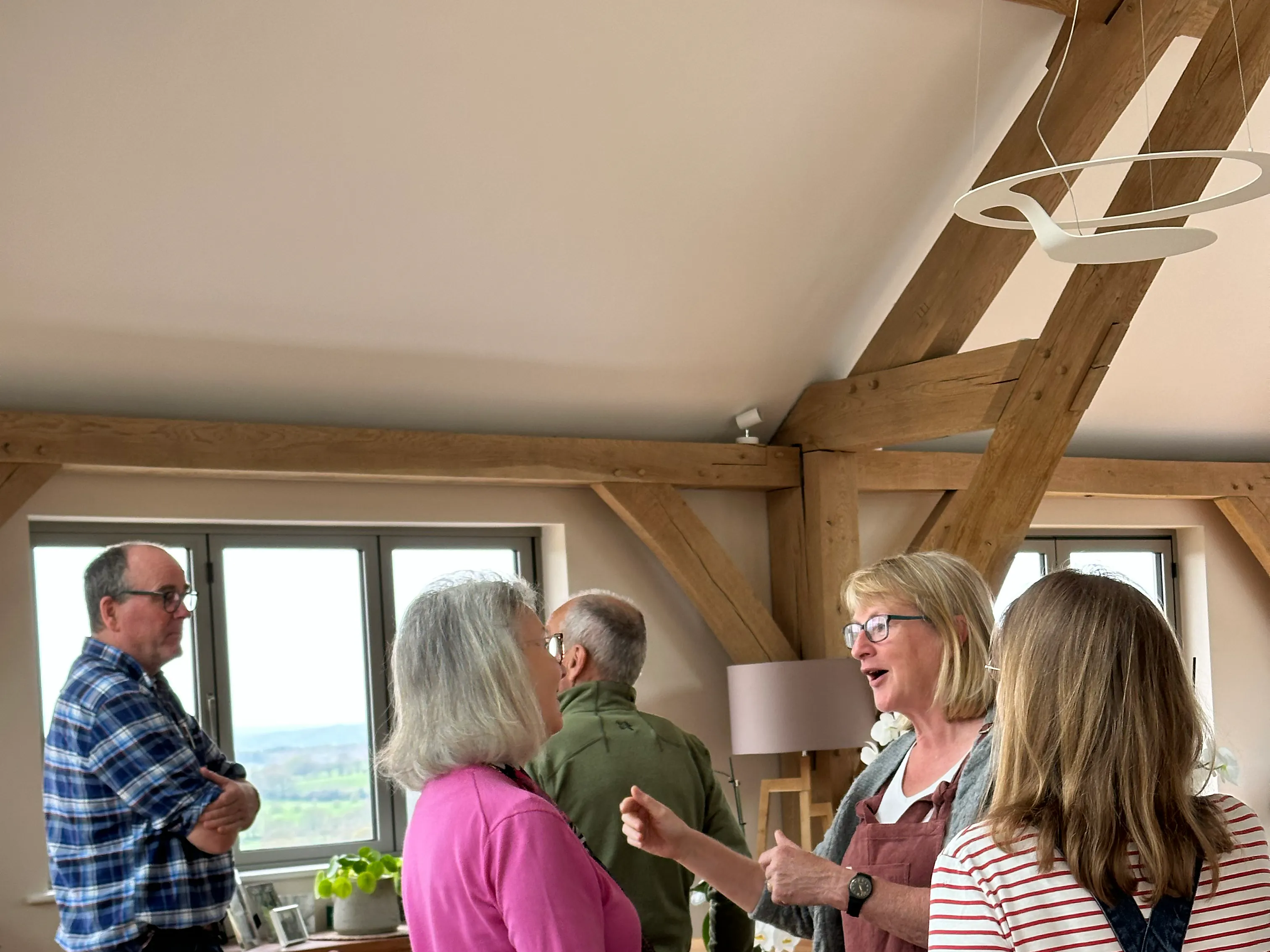 Attendees at an open house event at an oak framed home