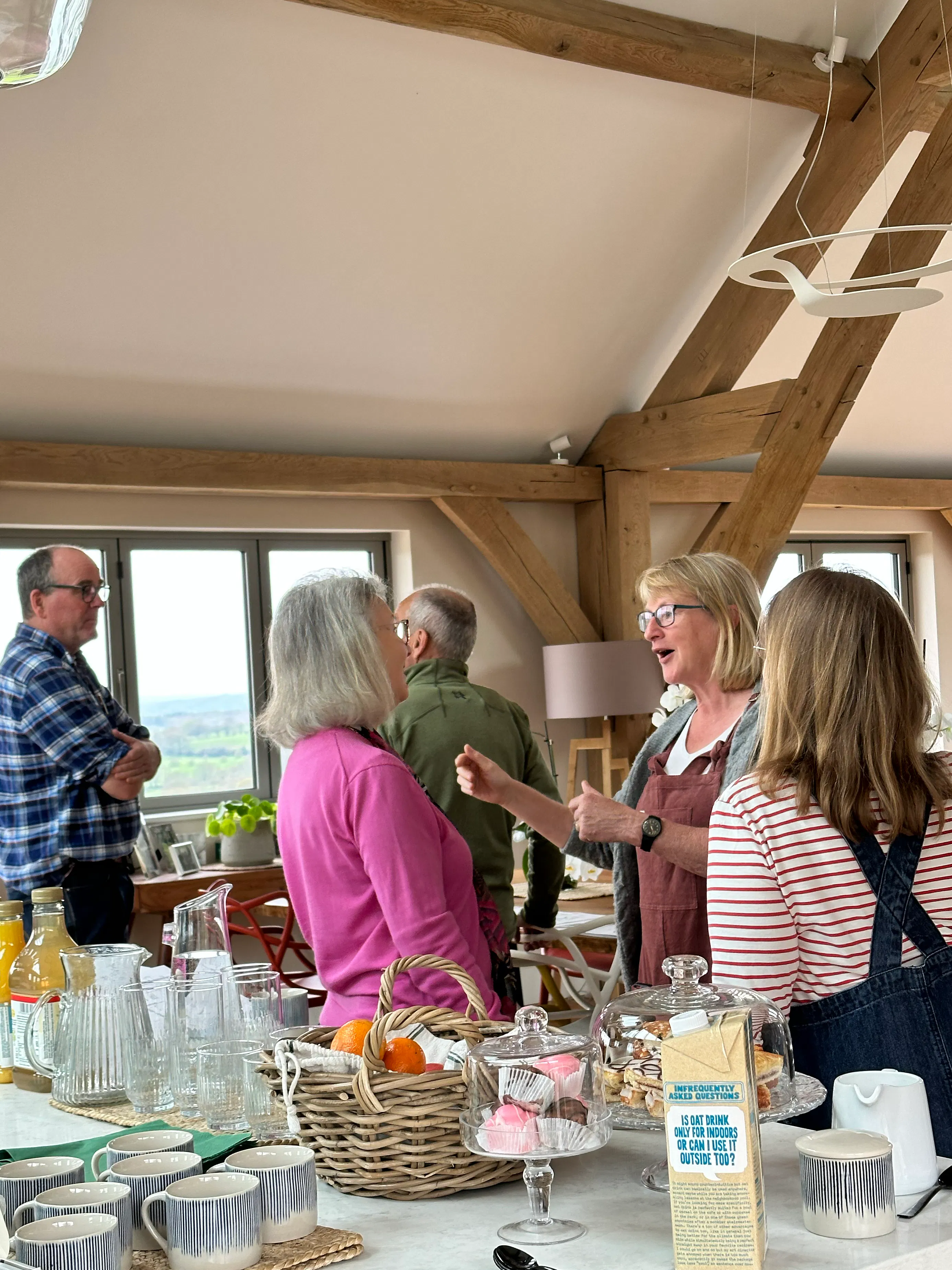 Attendees at an open house event at an oak framed home