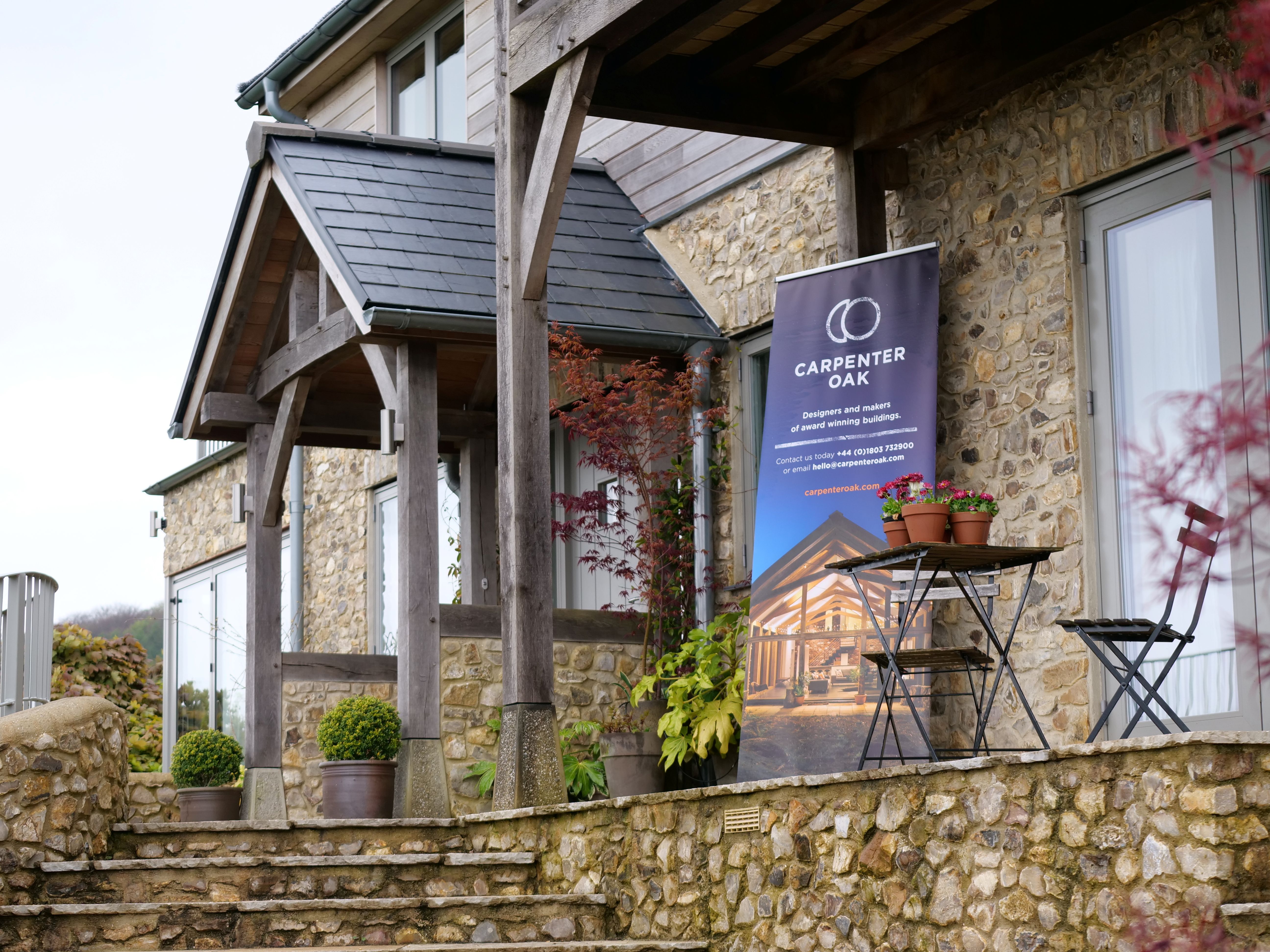 A banner outside an oak framed home at an open house event