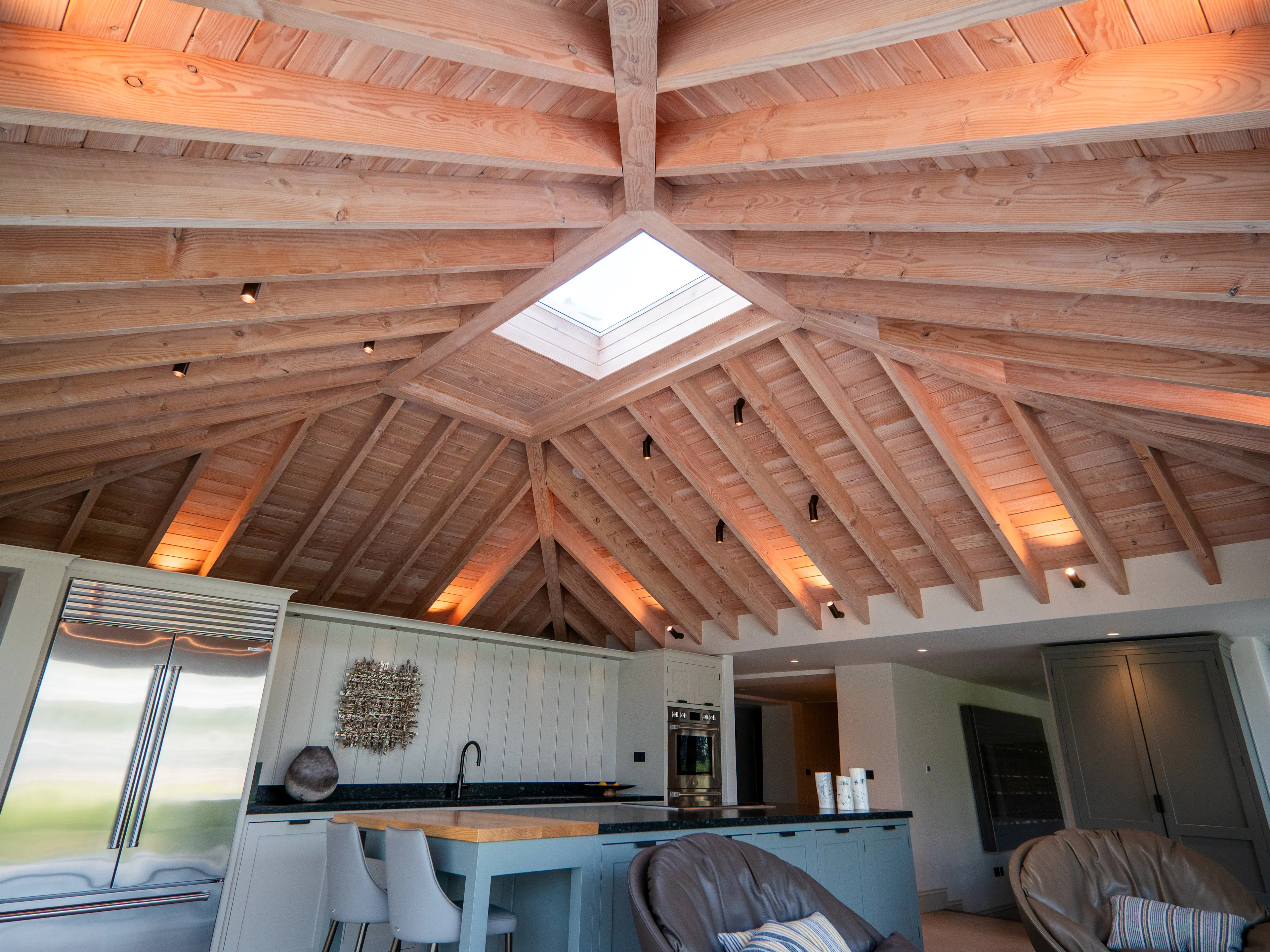 A contemporary Douglas fir glulam framed kitchen extension