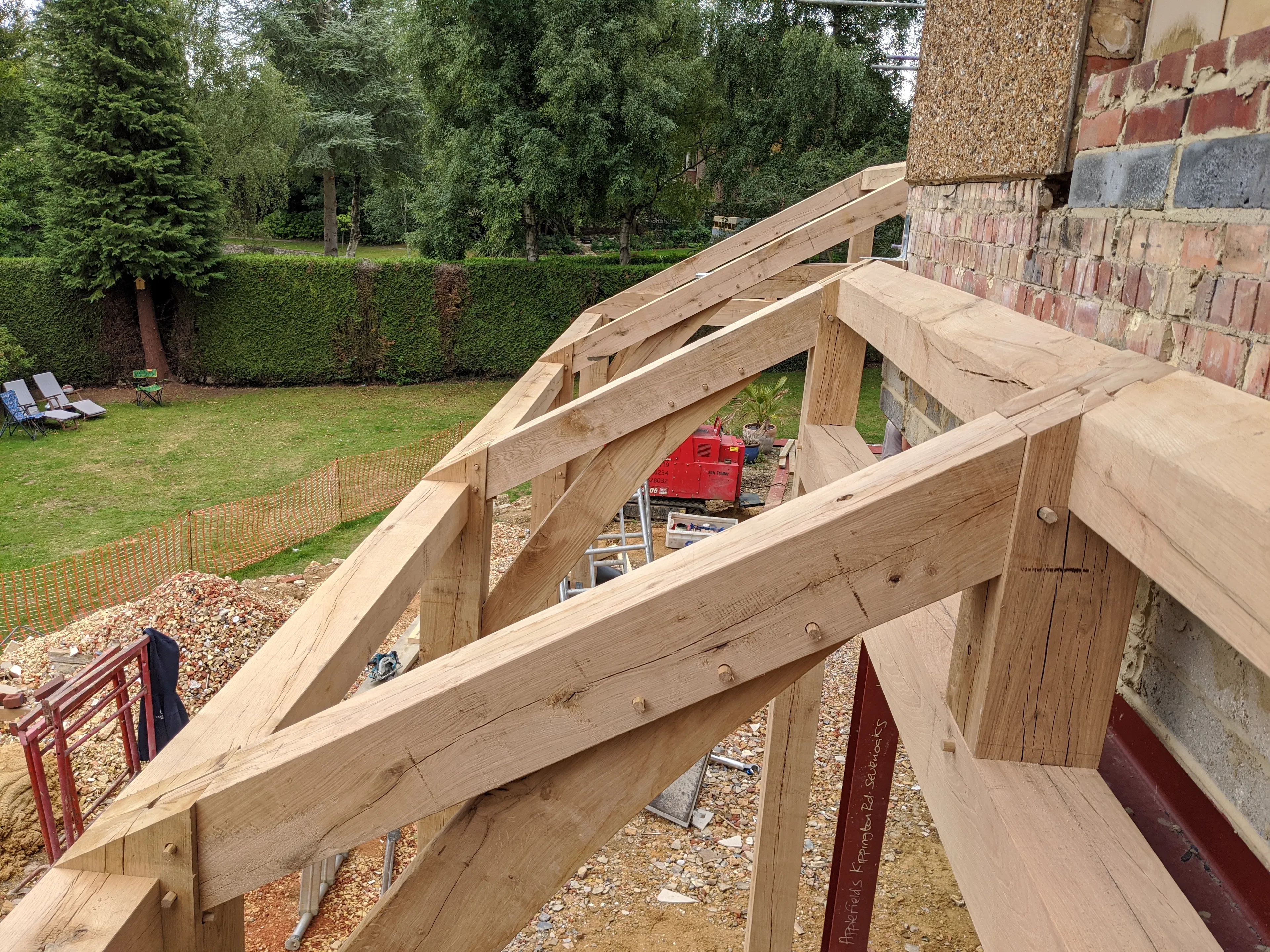 A close up of a frame during the installation for a modern oak framed extension