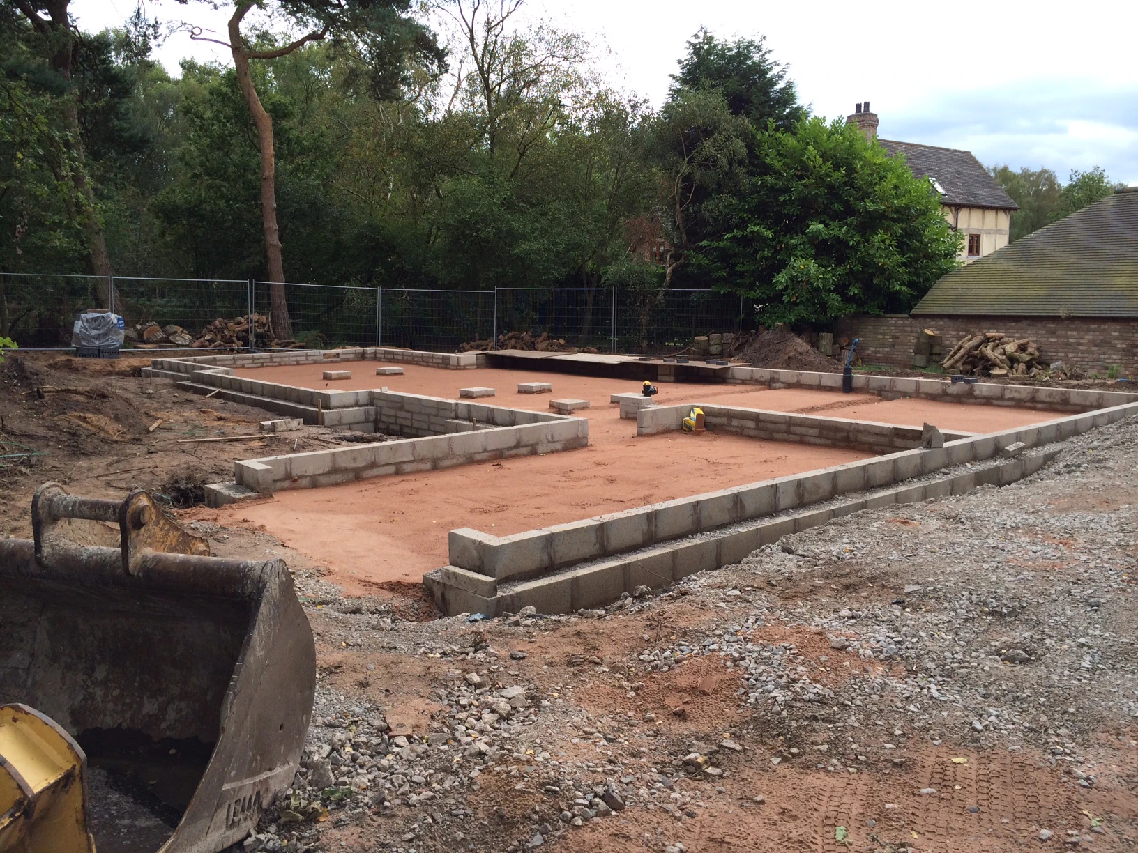Concrete foundations are ready for an oak frame to be installed for a new home