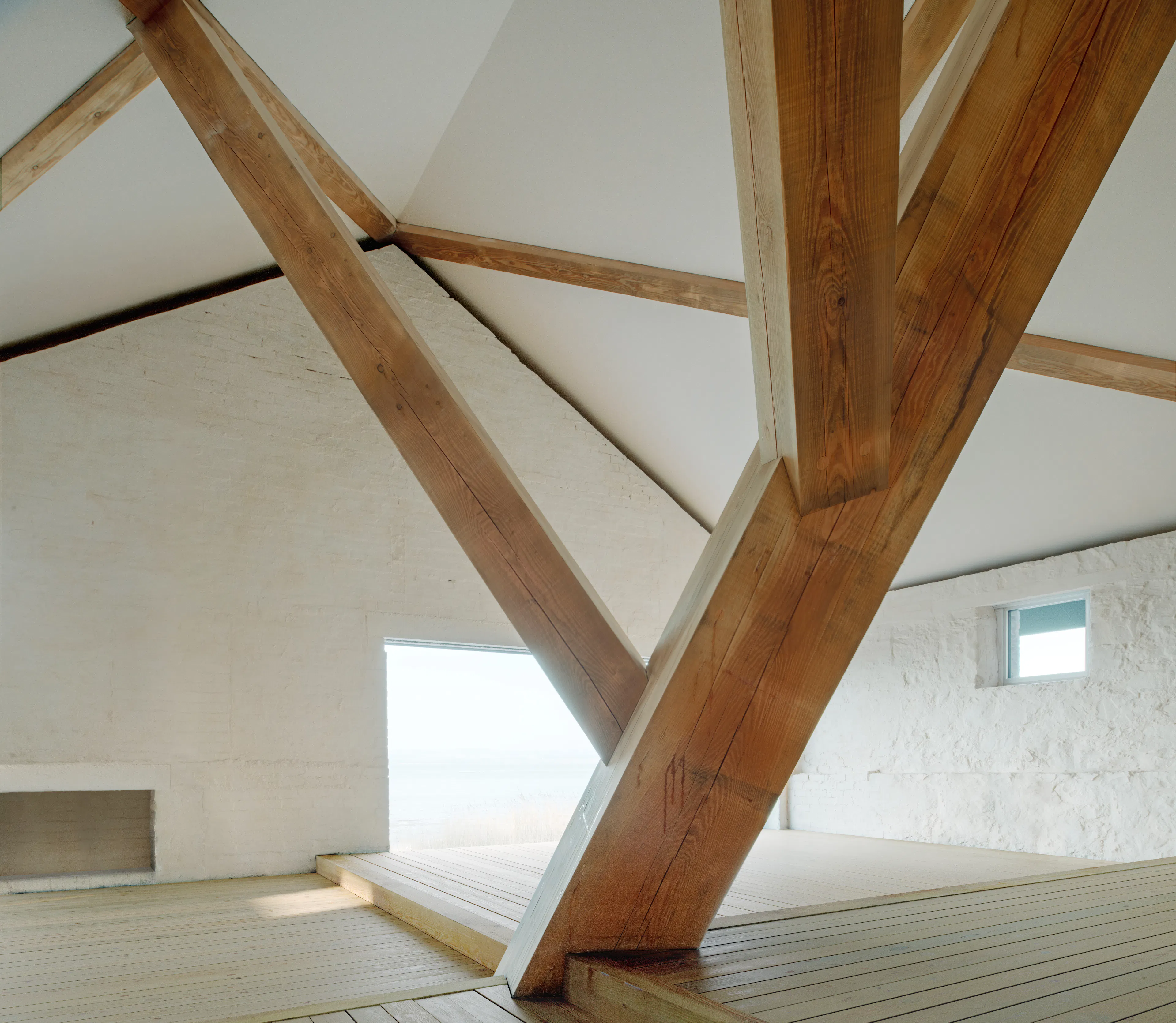 Interior of a finished boathouse featuring a Douglas fir and larch timber frame.
