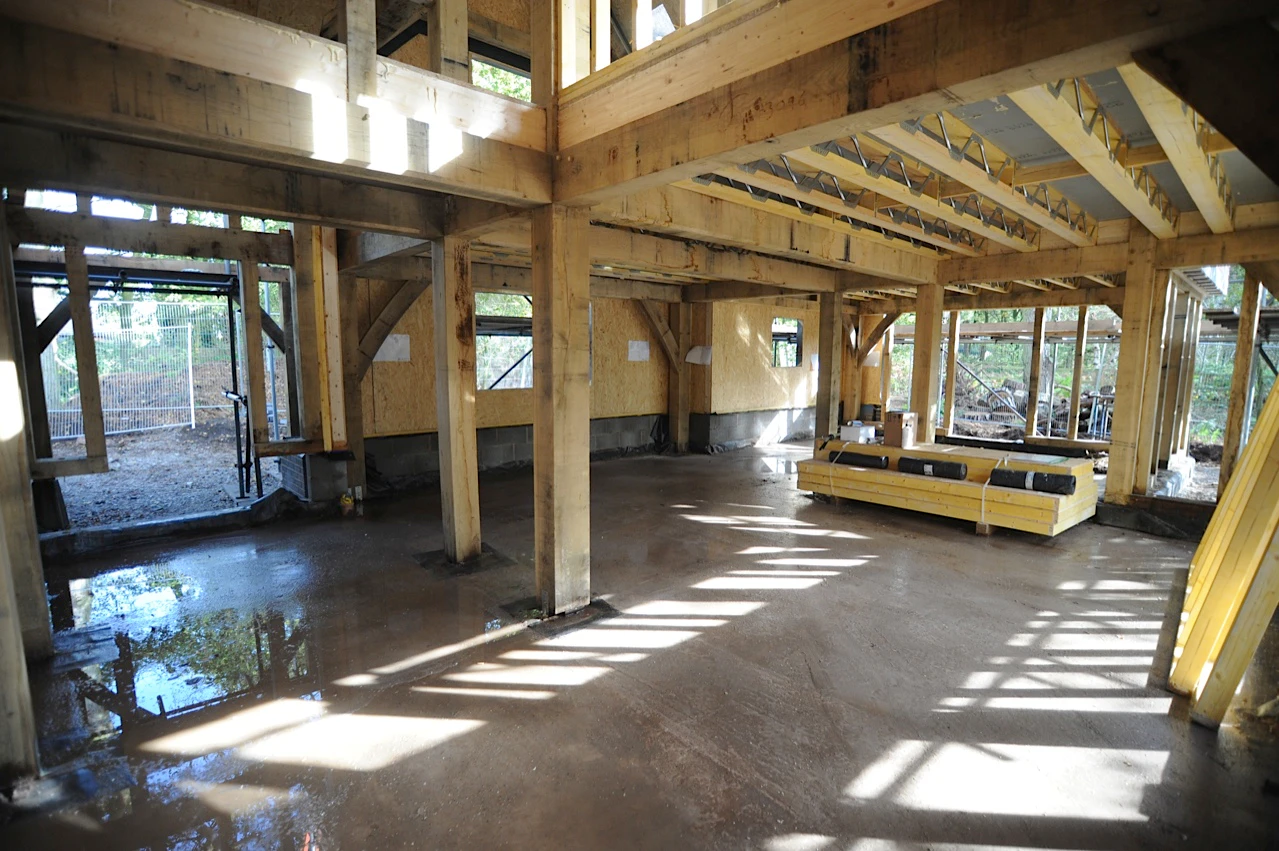 Encapsulation and insulation being installed for the oak frame at Higham Findlow site