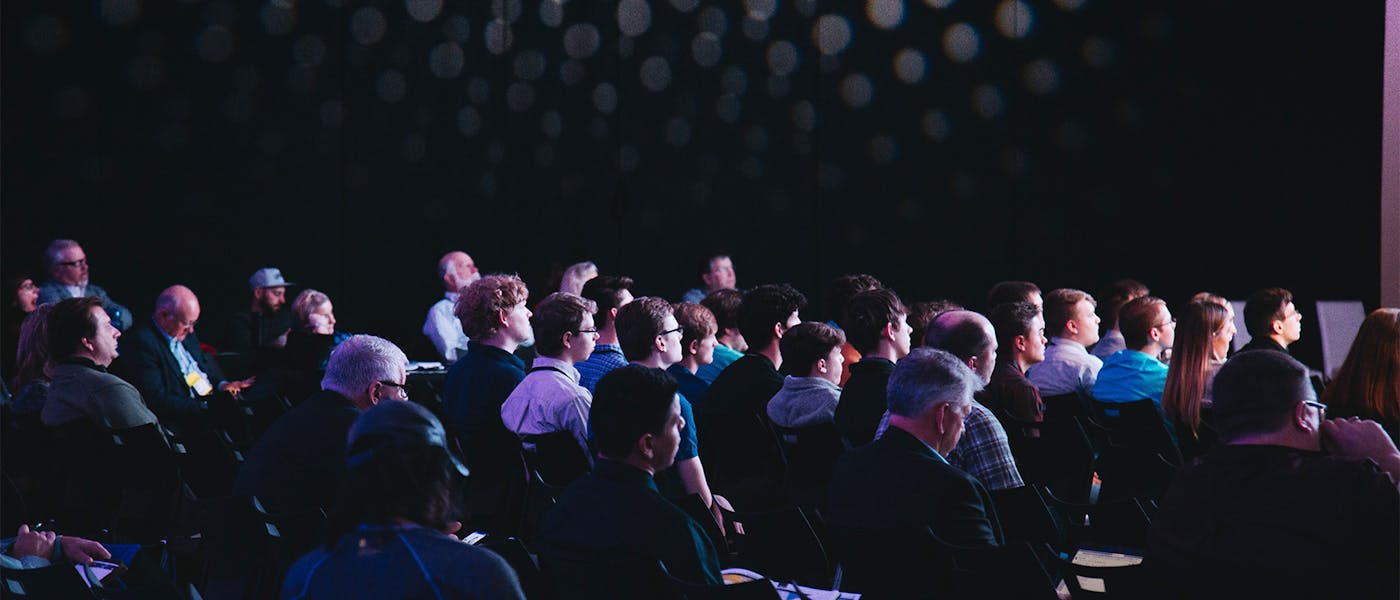 crowd at event in dark room