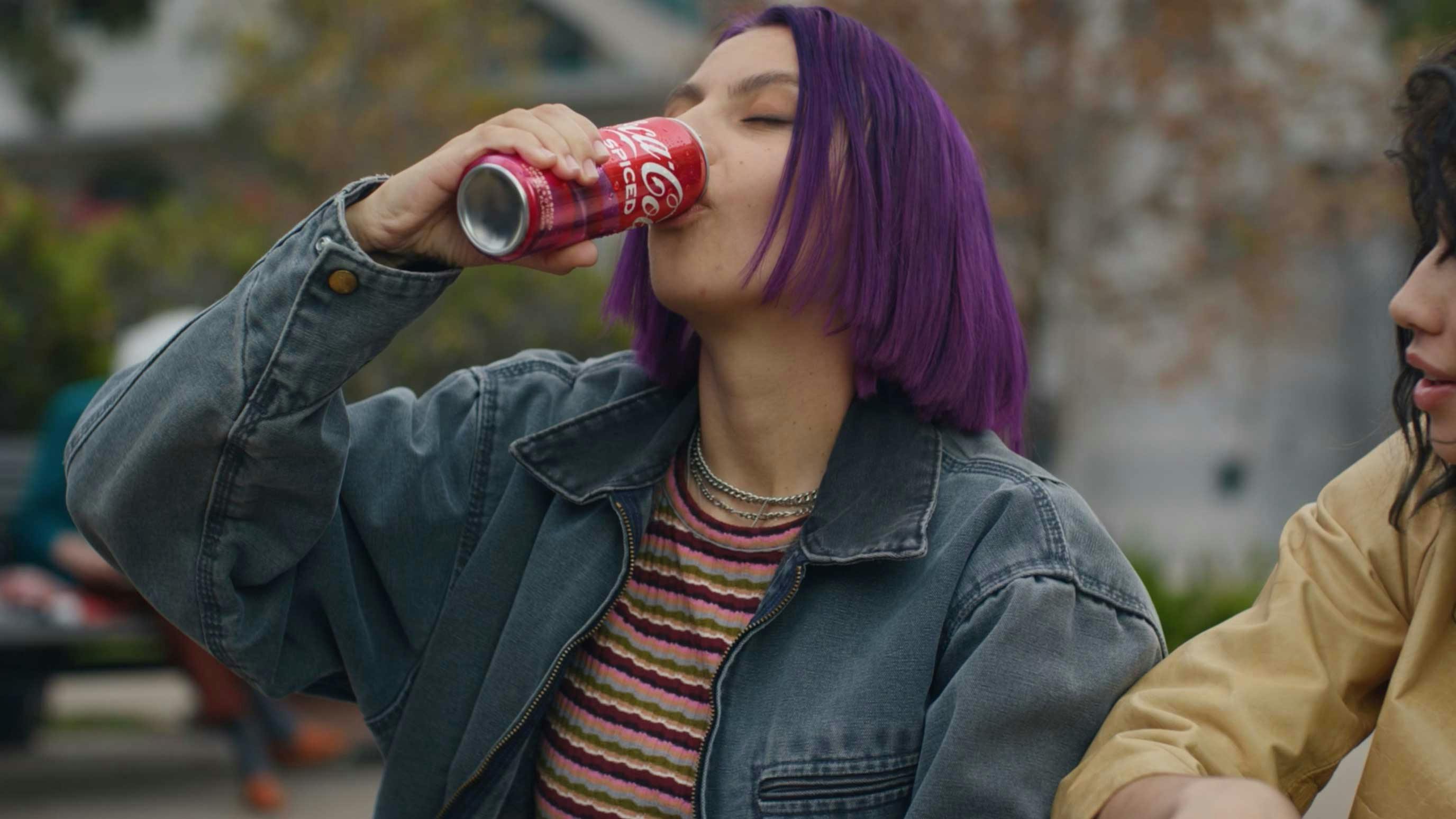Woman drinking coca-cola