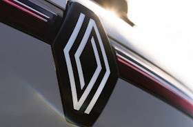 White Renault Megane Etech Electric badge.