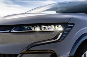 White Renault Megane Etech Electric headlights