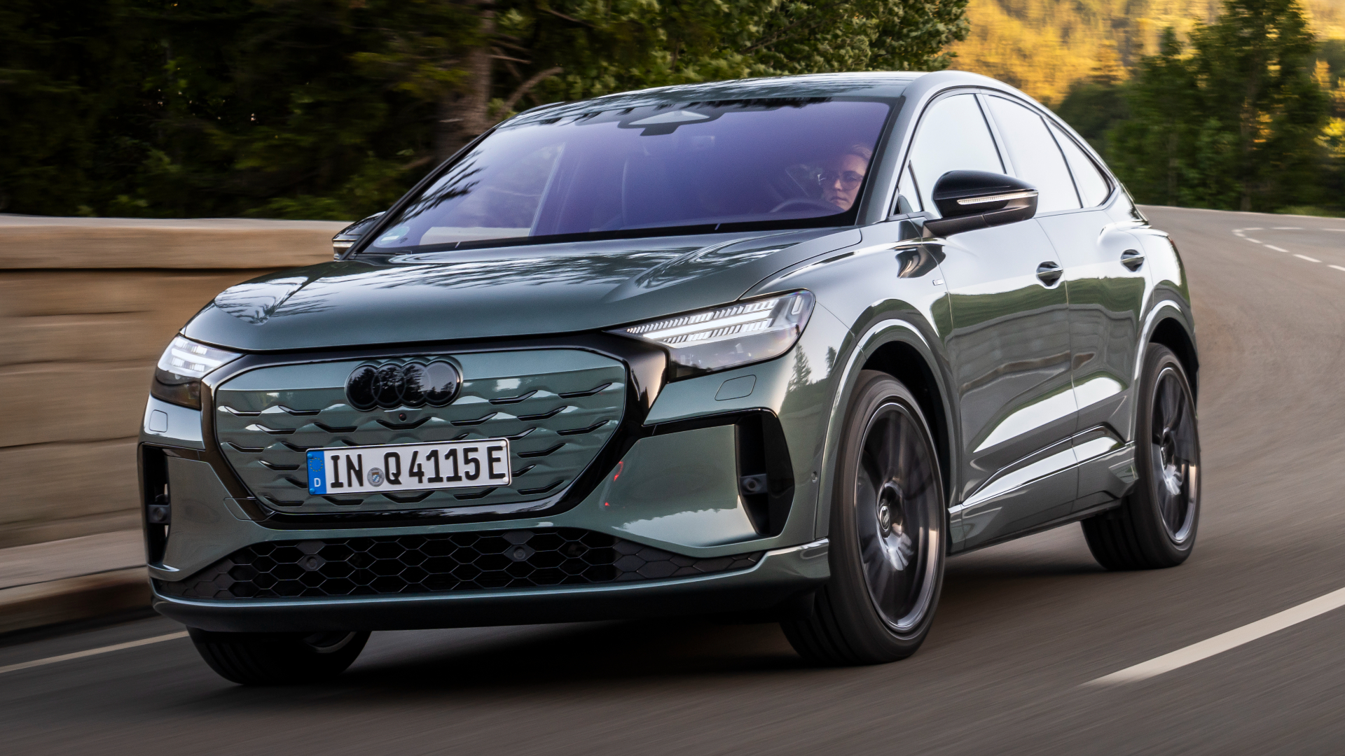 2026 Audi Q4 Sportback e-tron front quarter view, moving