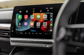 White Renault Megane Etech Electric infotainment screen.