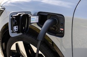 White Renault Megane Etech Electric charging pod