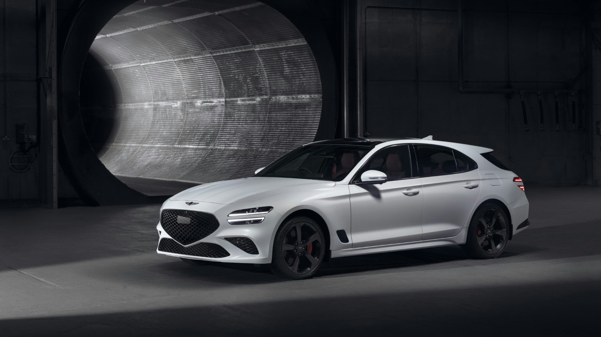 White 2022 Genesis G70 Shooting Brake parked in front of a tunnel, front quarter view
