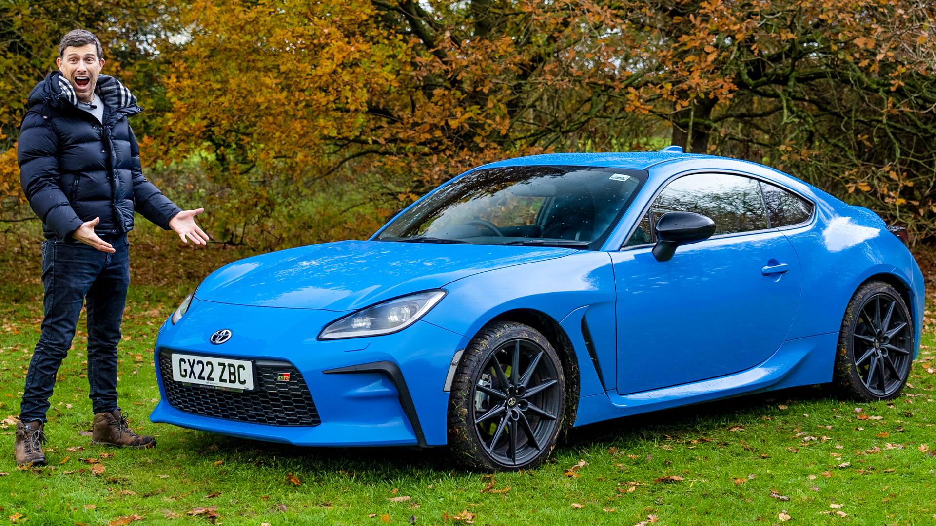2023 Toyota GR86 front quarter static blue parked in a field