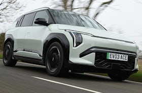2025 Kia EV3 RHD green exterior front three quarter view driving