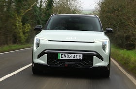 2025 Kia EV3 RHD green exterior front view driving