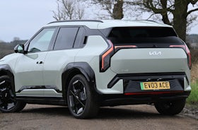 2025 Kia EV3 RHD green exterior rear three quarter view static