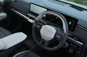 2025 Kia EV3 RHD green interior dashboard full view