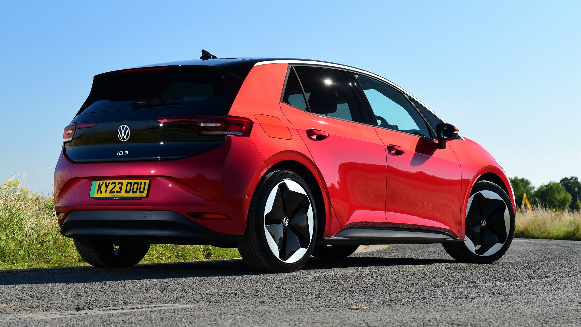 2025 Volkswagen ID.3 RHD red exterior rear three quarter view static