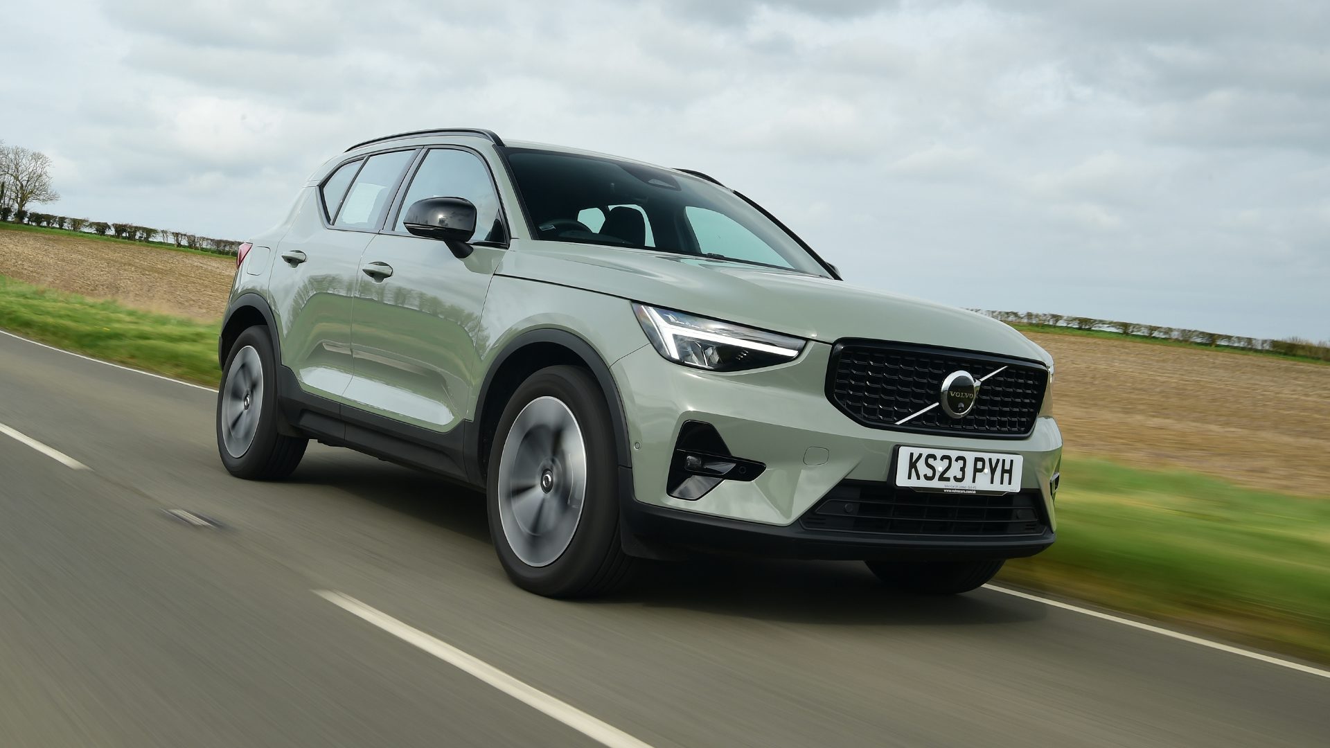 2025 Volvo XC40 RHD green exterior front three quarter view driving