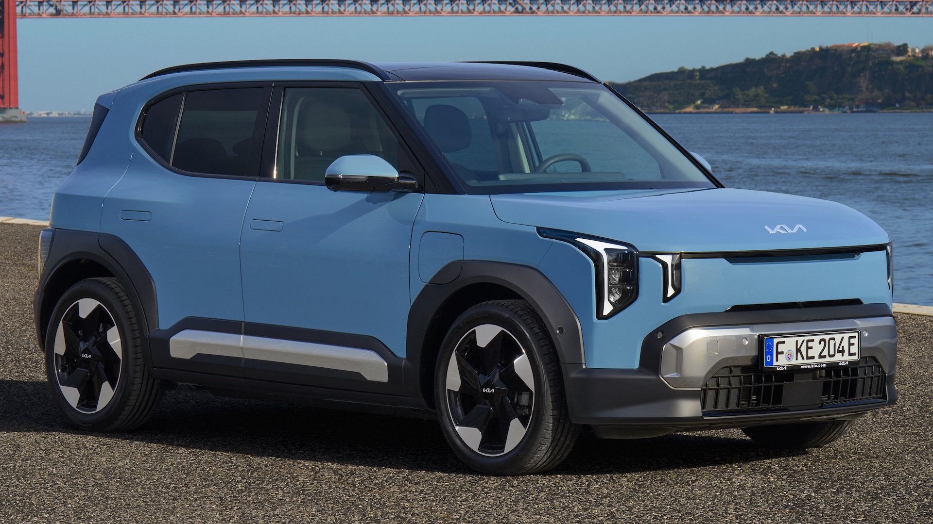 Blue 2026 Kia EV2 parked, front quarter.