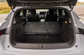 White Renault Megane Etech Electric boot with seat folded.