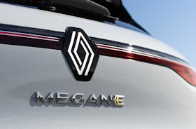 White Renault Megane Etech Electric badge.