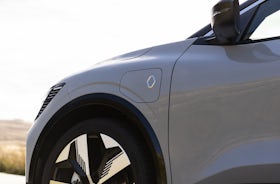 White Renault Megane Etech Electric side view and front wheels