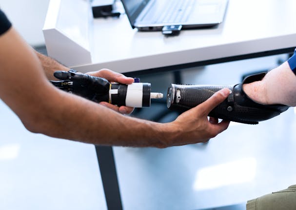 A biomedical engineer working on a prosthetic arm