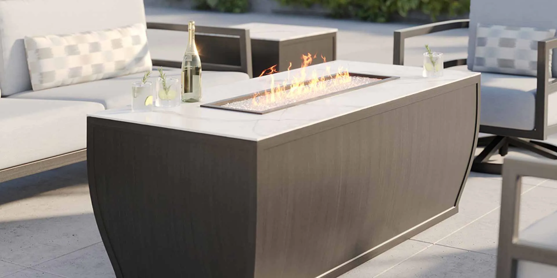 Largo fire table in outdoor patio setting by Castelle.