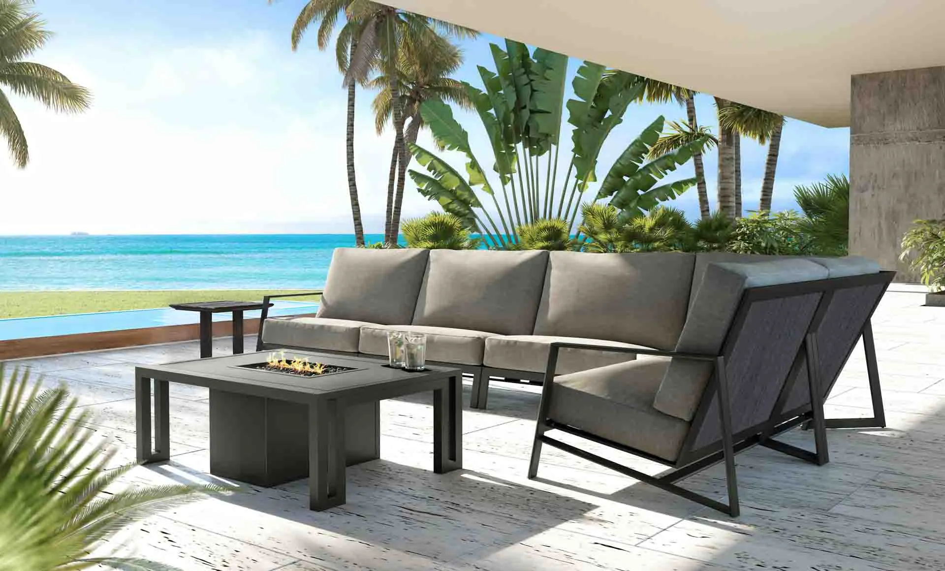 Outdoor furniture ensemble with fire pit in tropical oceanfront setting.