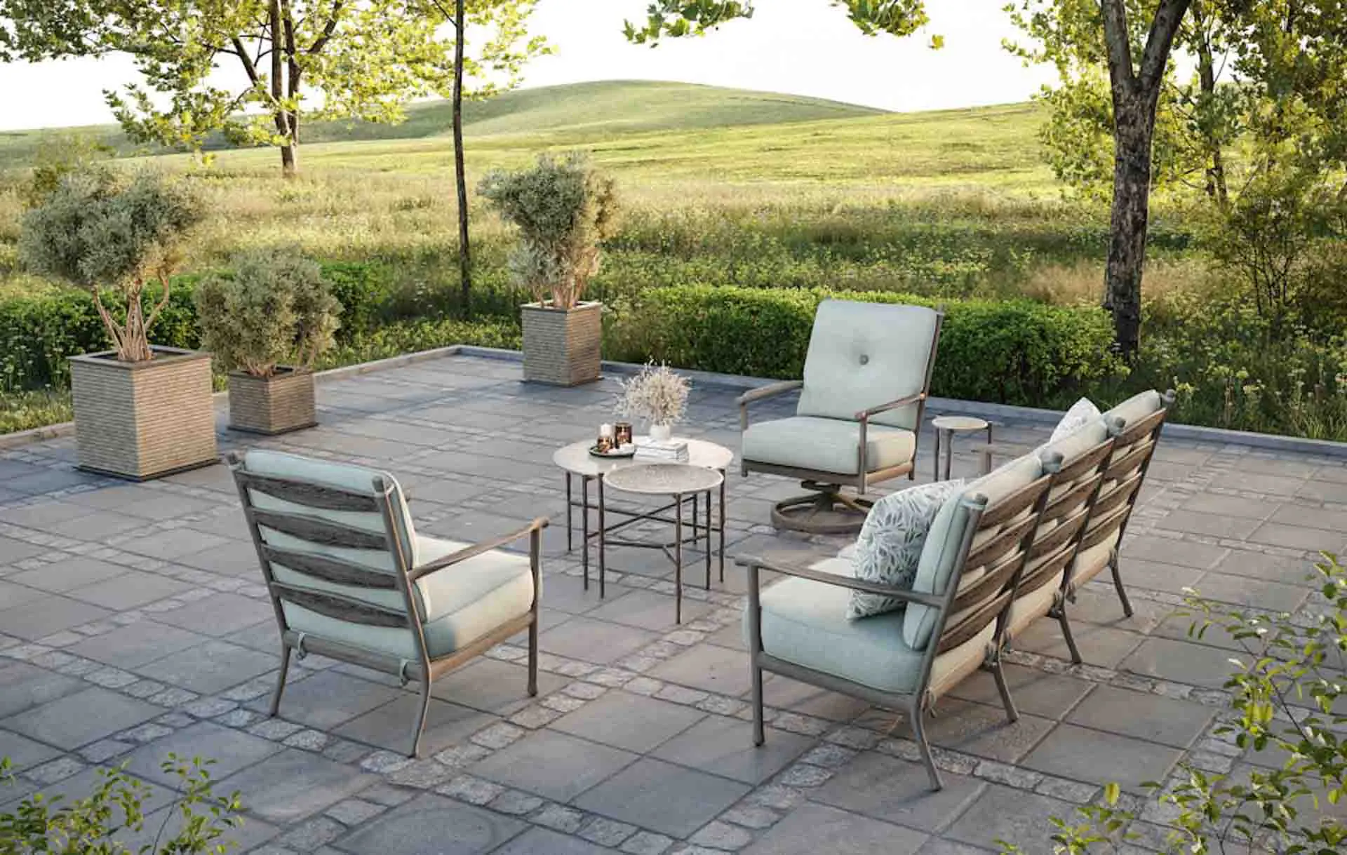 Relaxing garden furniture setting with cushioned lounge furniture and table.